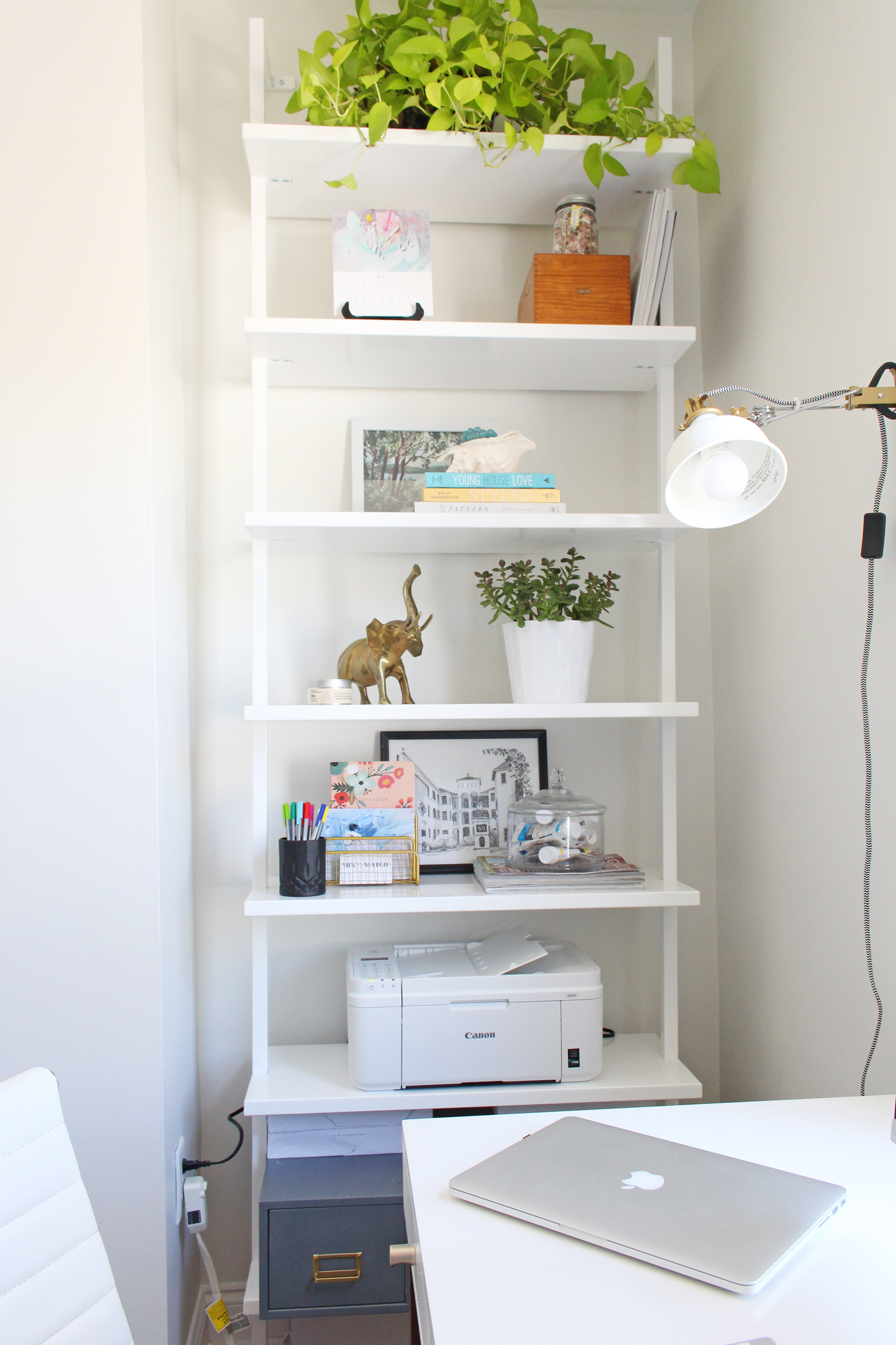 The CB2 Stairway bookcase is the perfect modern storage solution in a home office or living space.