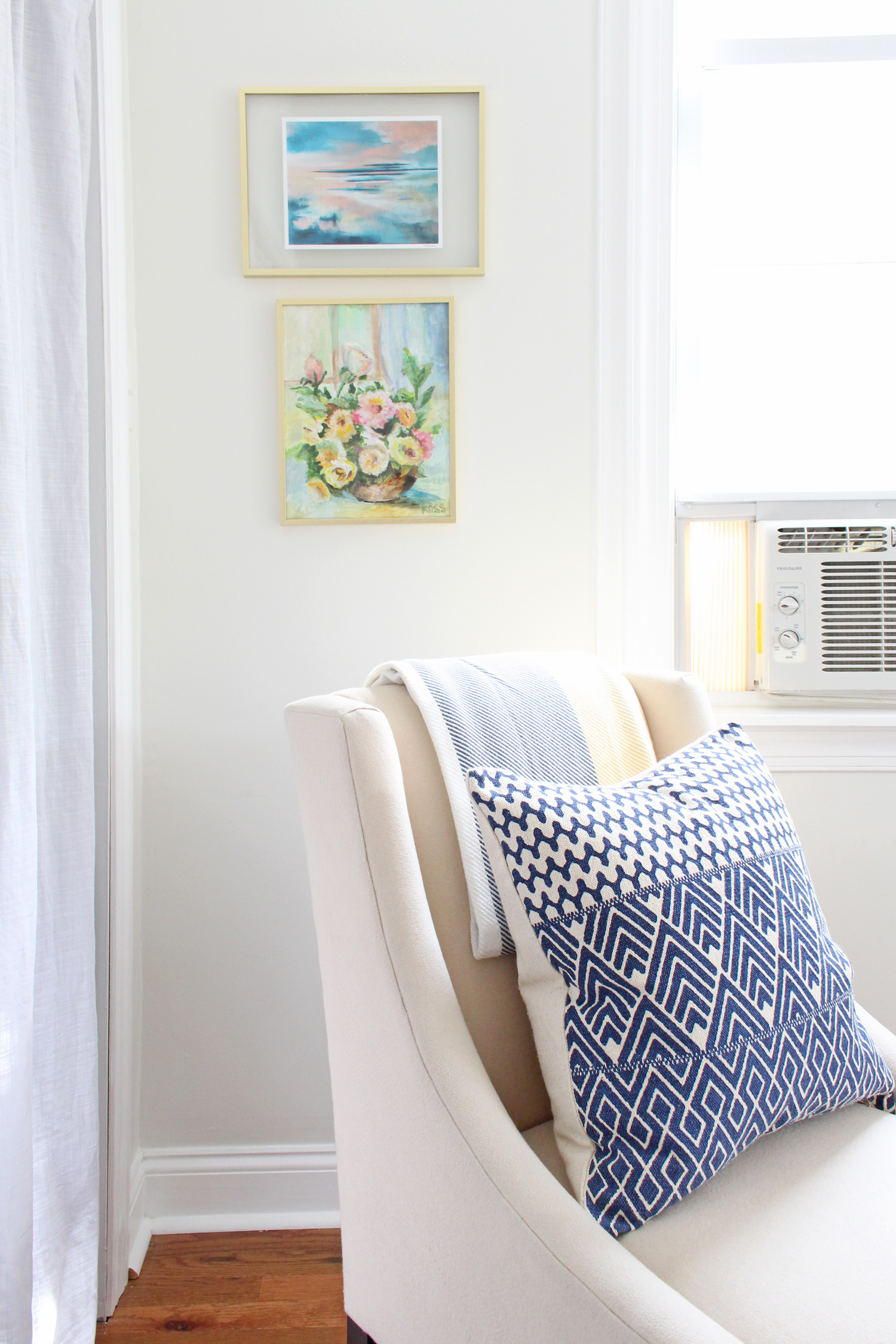 An abstract print from Modern South Studio and a vintage botanical painting add color and style to this corner of the office.