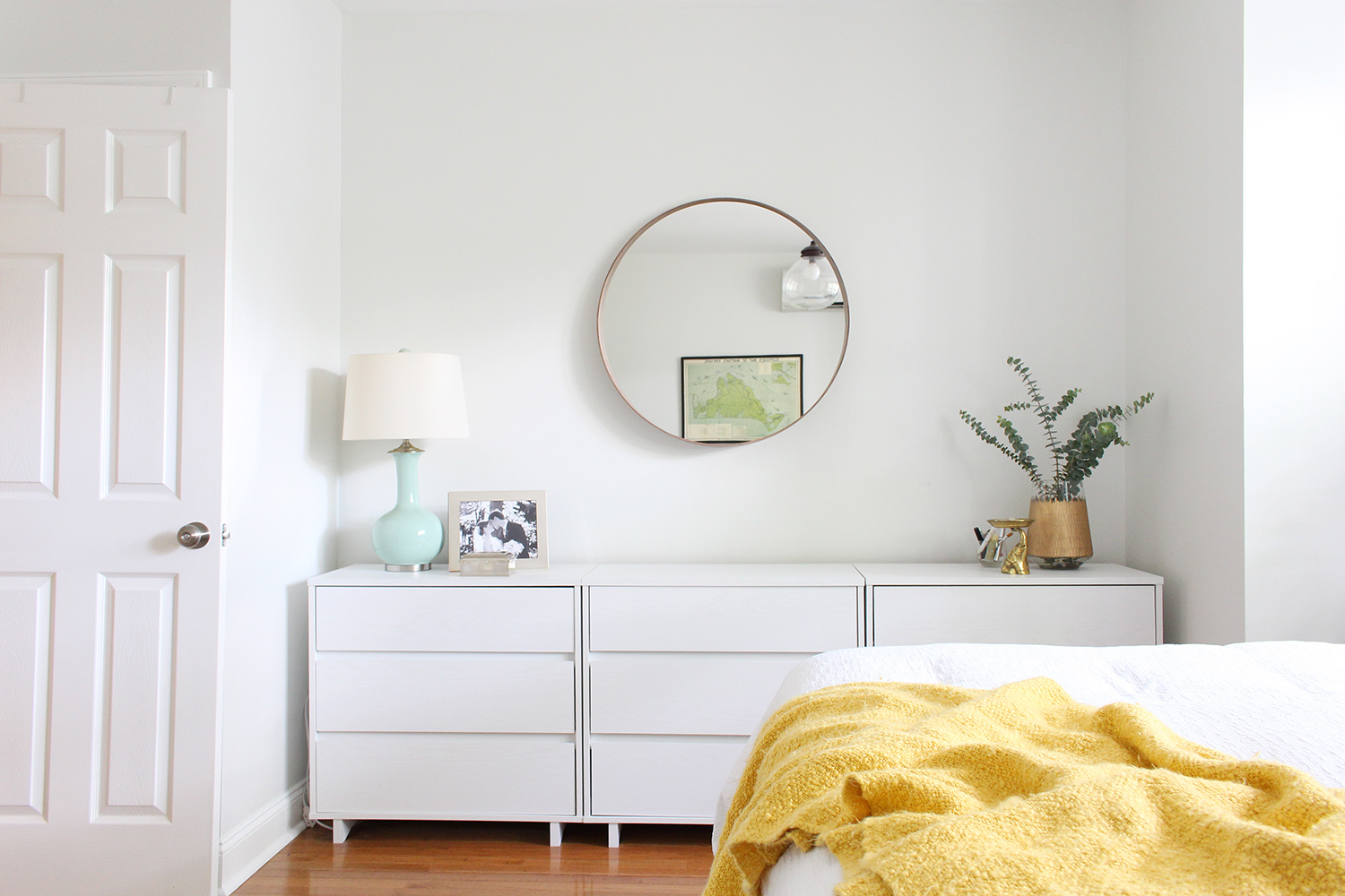 A row of three budget-friendly, modern dressers from Target fill this bedroom nook perfectly.