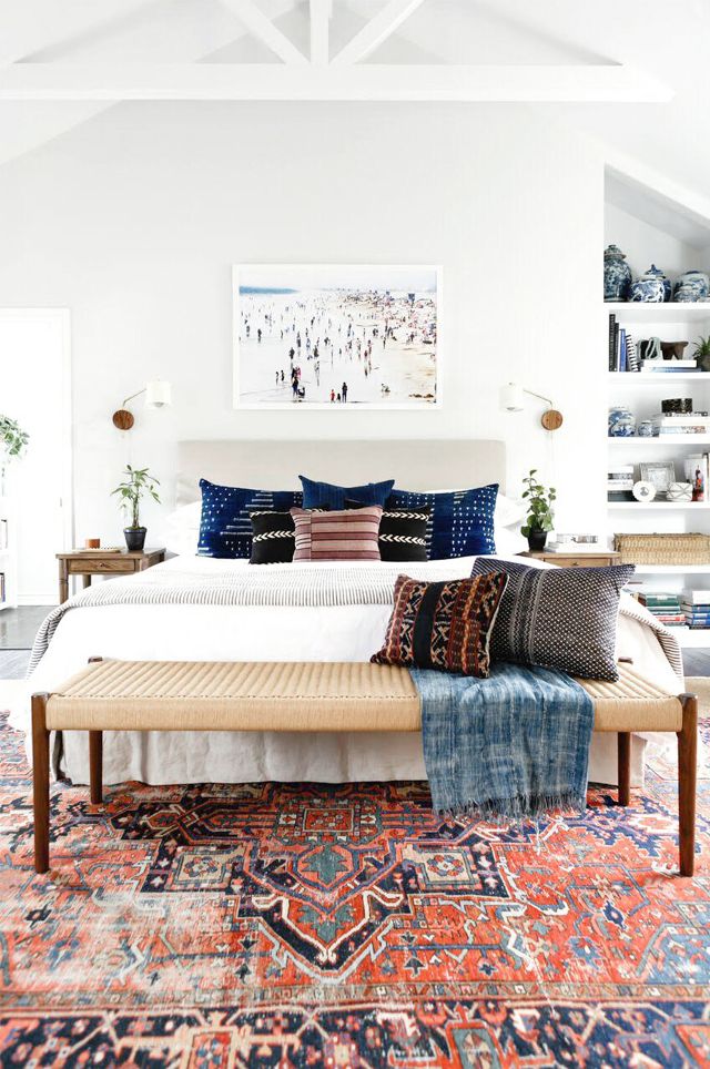 How to decorate around a bed. Eclectic boho bedroom. // Hang art over bed, hang above bed