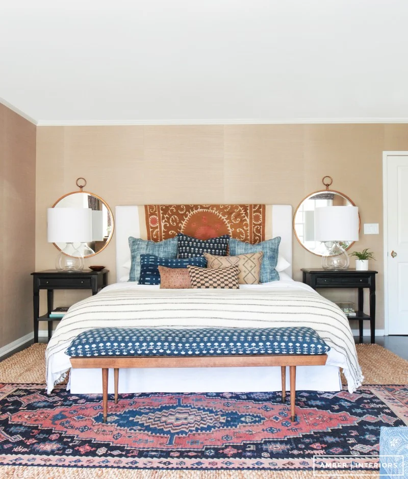 How to decorate around a bed. Option: add round mirrors on either side above nightstands. (Design: Amber Interiors) // bohemian bedroom, mid-century boho bedroom, colorful bedroom, california style bedroom