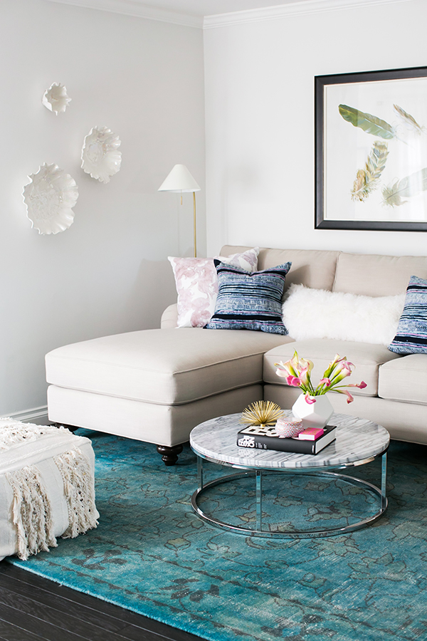 Get the look of this space on the blog! Neutral living room with overdyed teal rug.