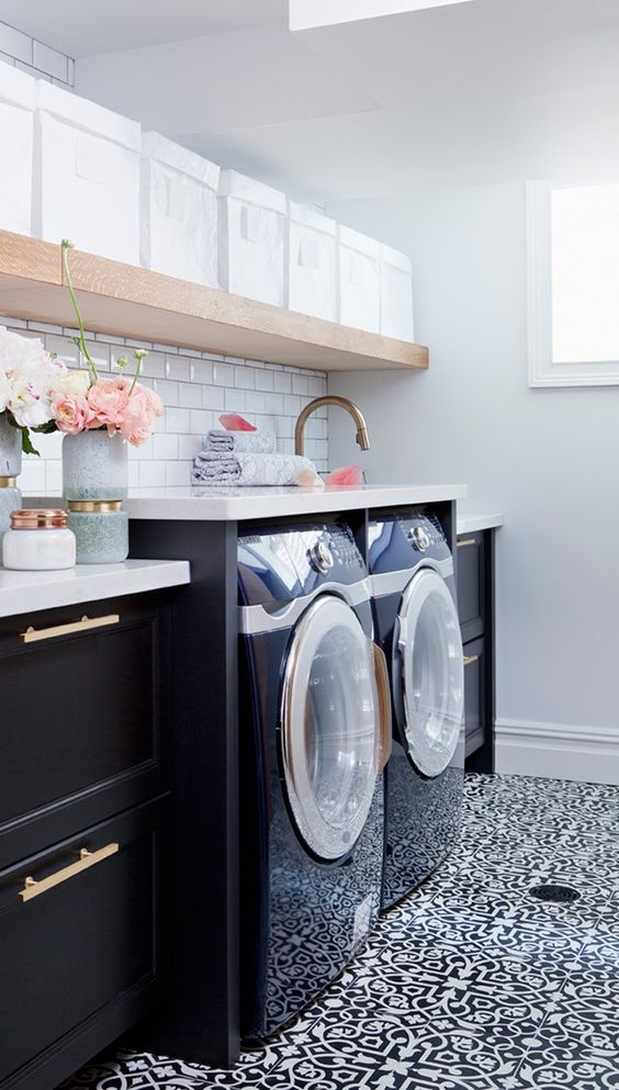 Tiled walls and floor in laundry room