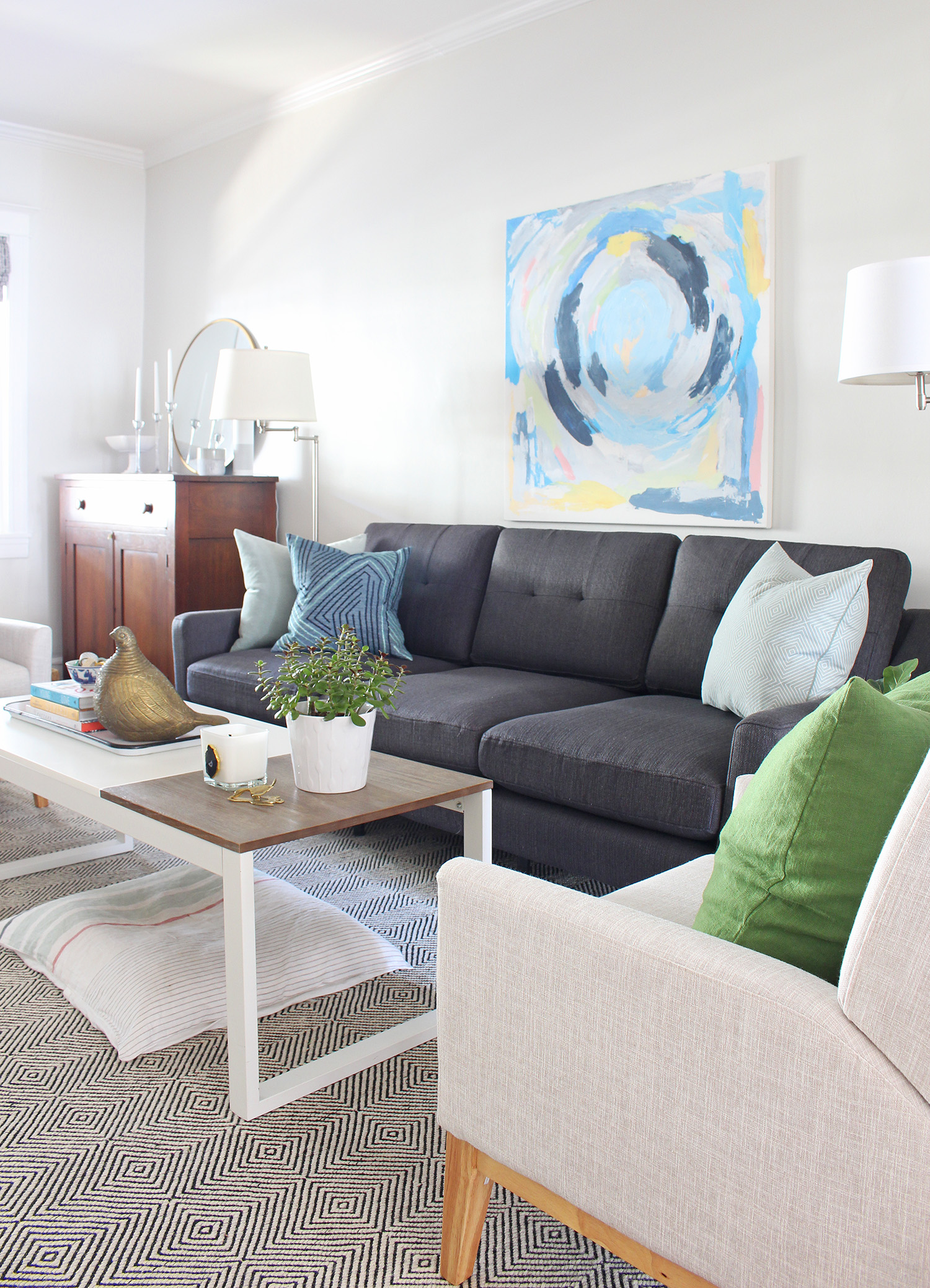 Burrow sofa in charcoal in this mid-century modern eclectic living room. Enter code MIXANDMATCH at checkout to get $50 off of your purchase!
