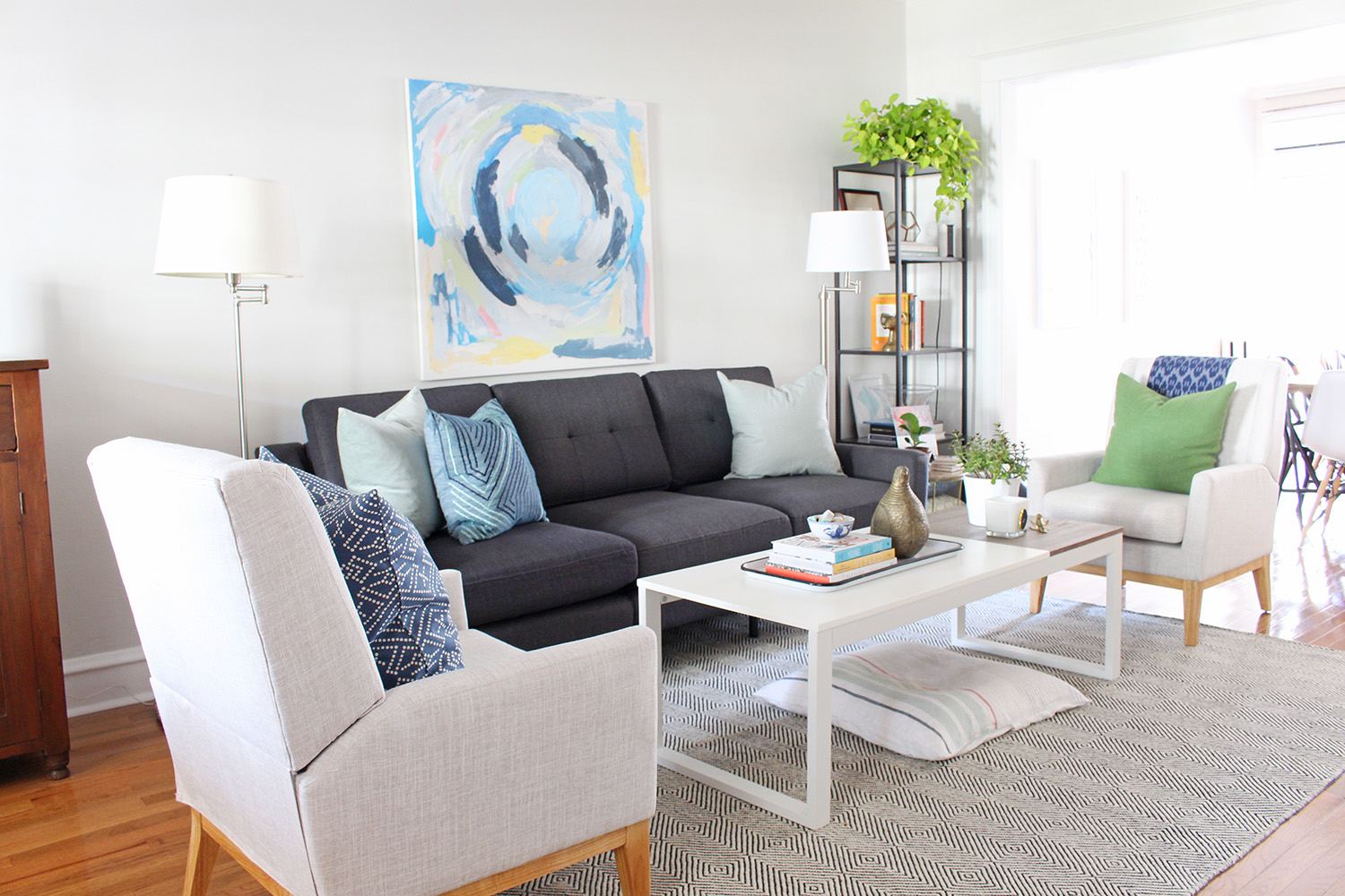 A new gray mid-century modern sofa updates the look of this living room. Head to Burrow.com to purchase your sofa and use code MIXANDMATCH to get $50 off of your purchase.