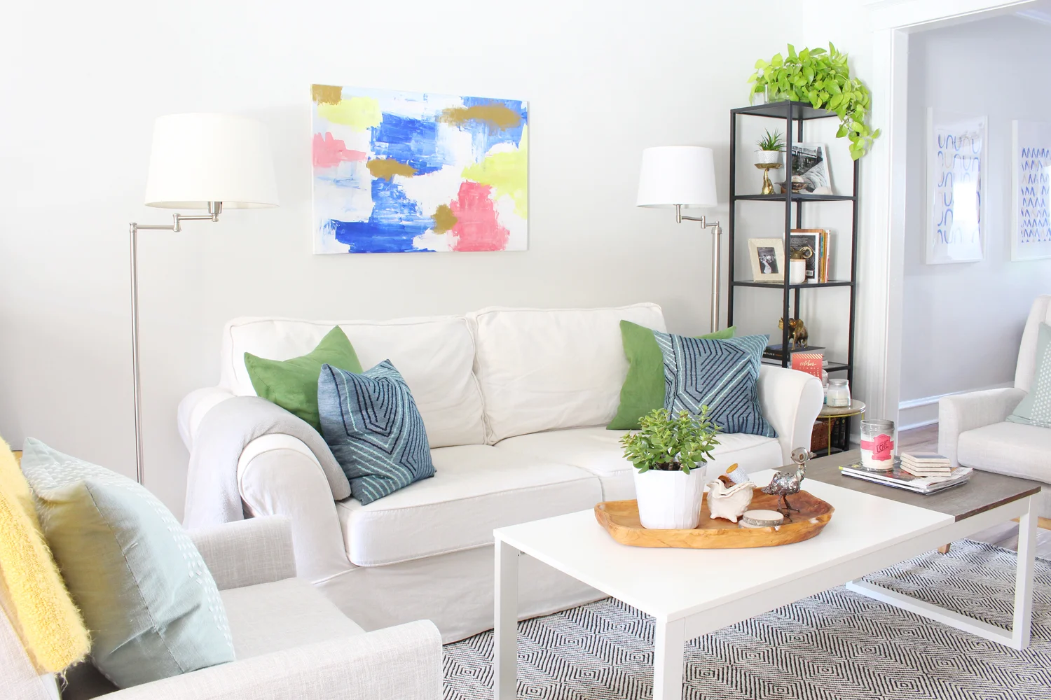 A bright, eclectic living room. // pottery barn sofa, white living room