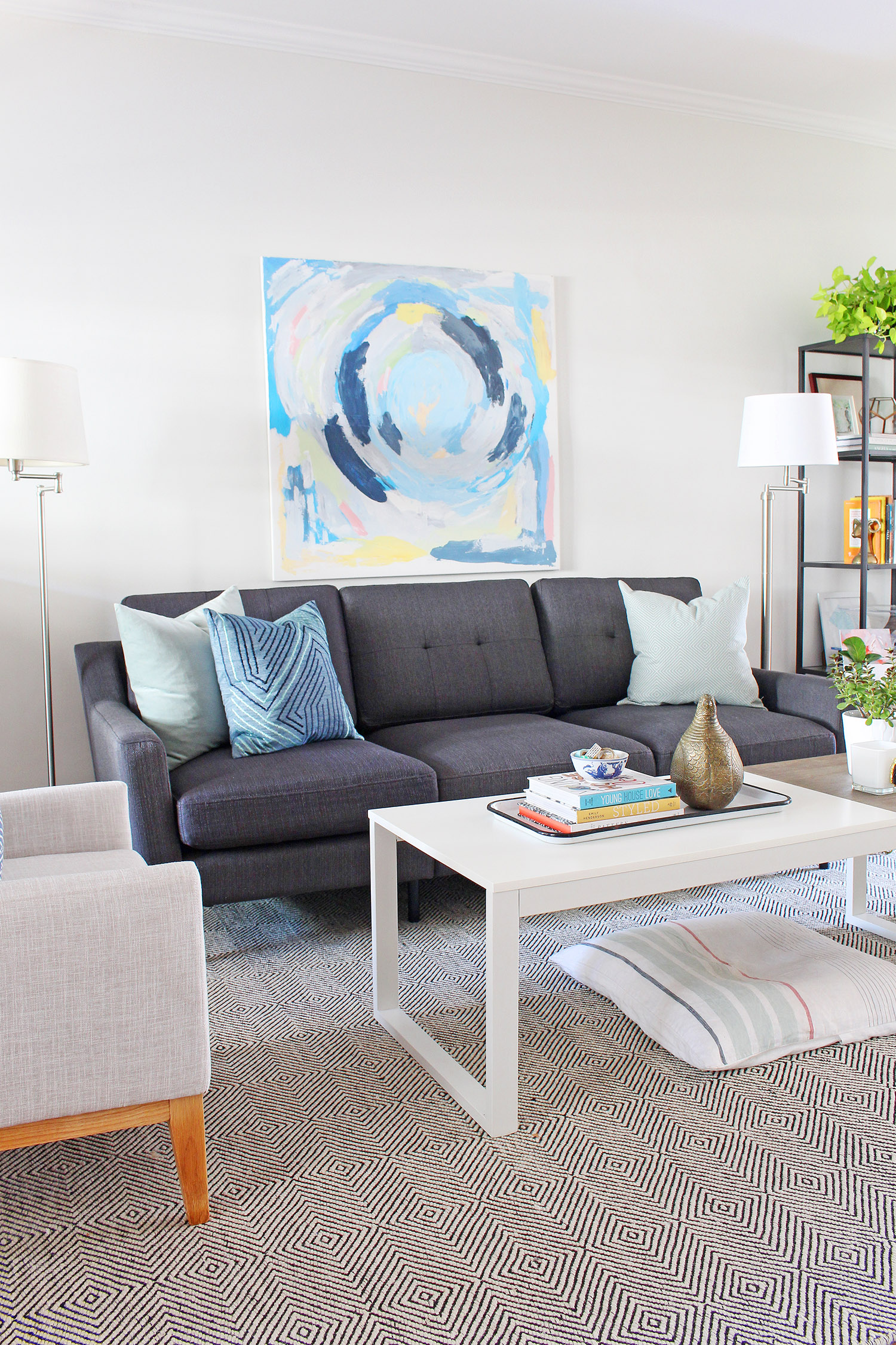 A new gray mid-century modern sofa updates the look of this living room. Head to Burrow.com to purchase your sofa and use code MIXANDMATCH to get $50 off of your purchase.