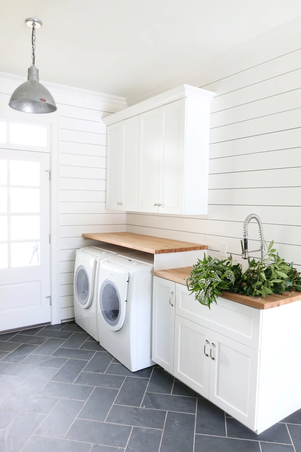 Laundry room with shiplap walls and herringbone tile floor // shiplap walls