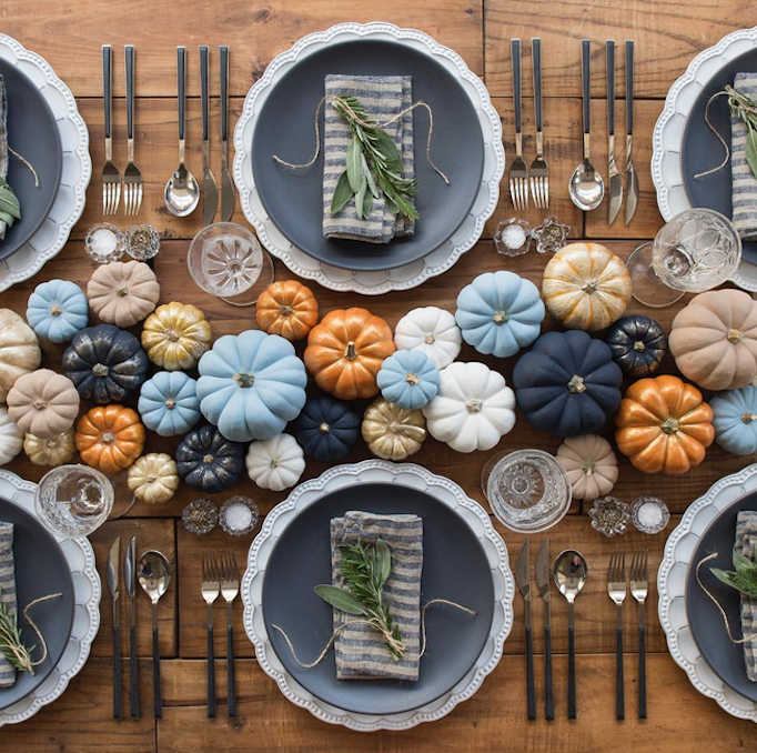 Non-traditional Thanksgiving tablescape with blues, golds, and oranges. Want more table decorating inspiration? Head to this post!