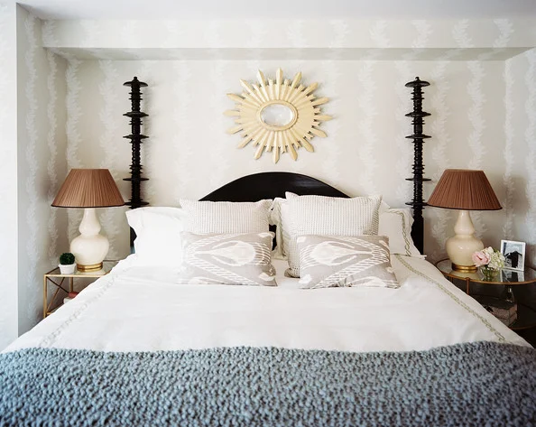 Is it possible to use mismatched nightstands in your bedroom? Absolutely! Find out how to do it well in this blog post. Here's a beautiful example in a small traditional bedroom with gold bedside tables.