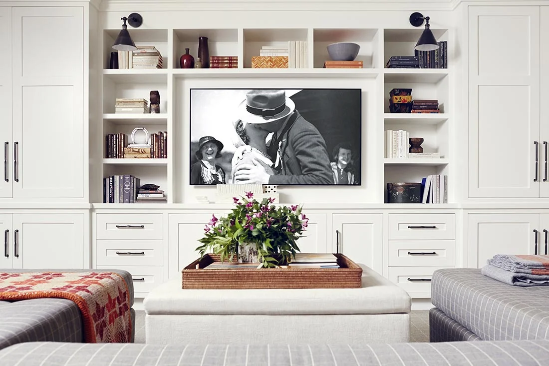 How to decorate around a TV. Distract from that big black box by adding beautifully styled bookshelves around it. Come see other ideas and inspiration in this blog post!
