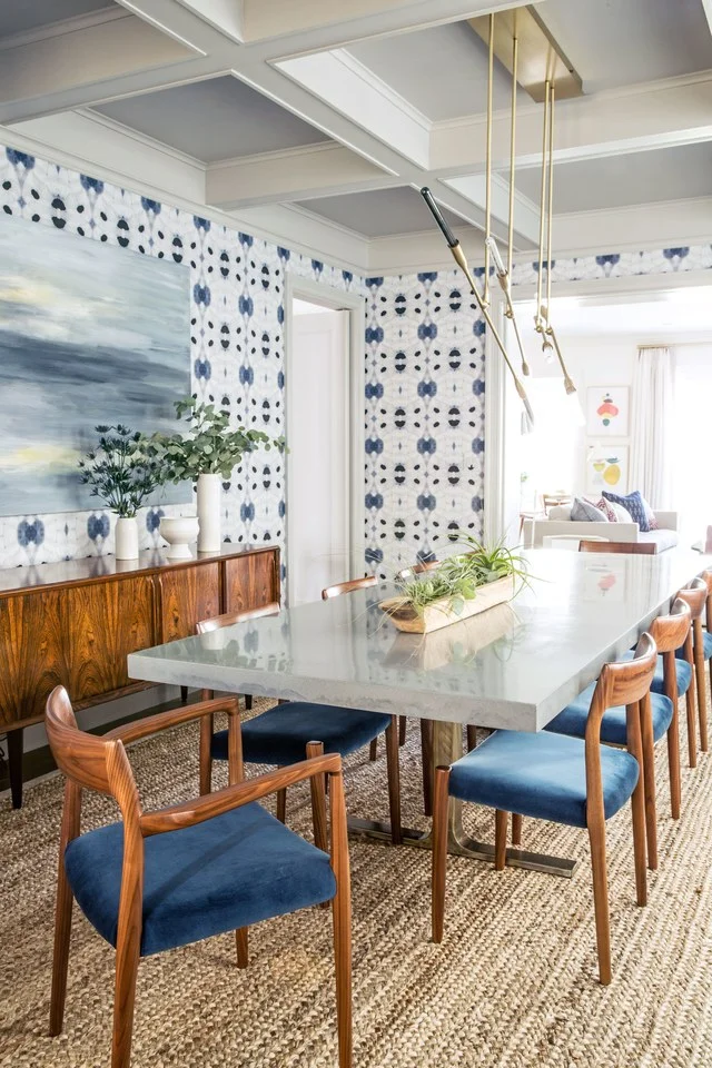 Get the look of this mid-century modern dining room on the blog! That indigo wallpaper is gorgeous, and complements the warm wood tones of the furniture beautifully.