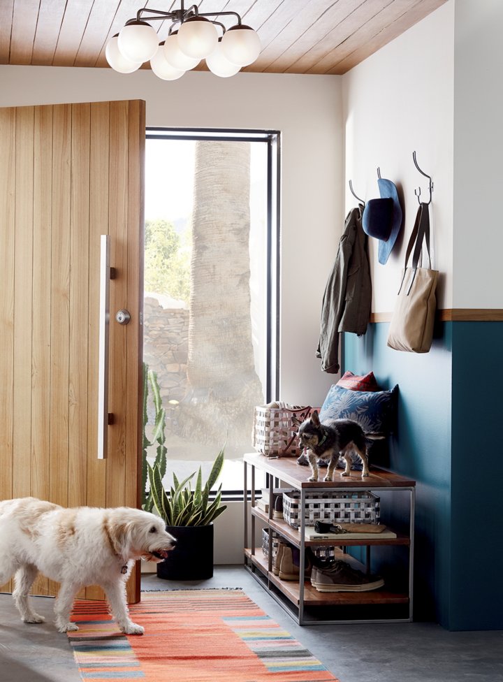 Add a bench and coats by the front door to create an entryway and drop zone. Make an entryway even if you don't have a true foyer. See more creative entryway ideas on the Mix & Match Design Company blog!