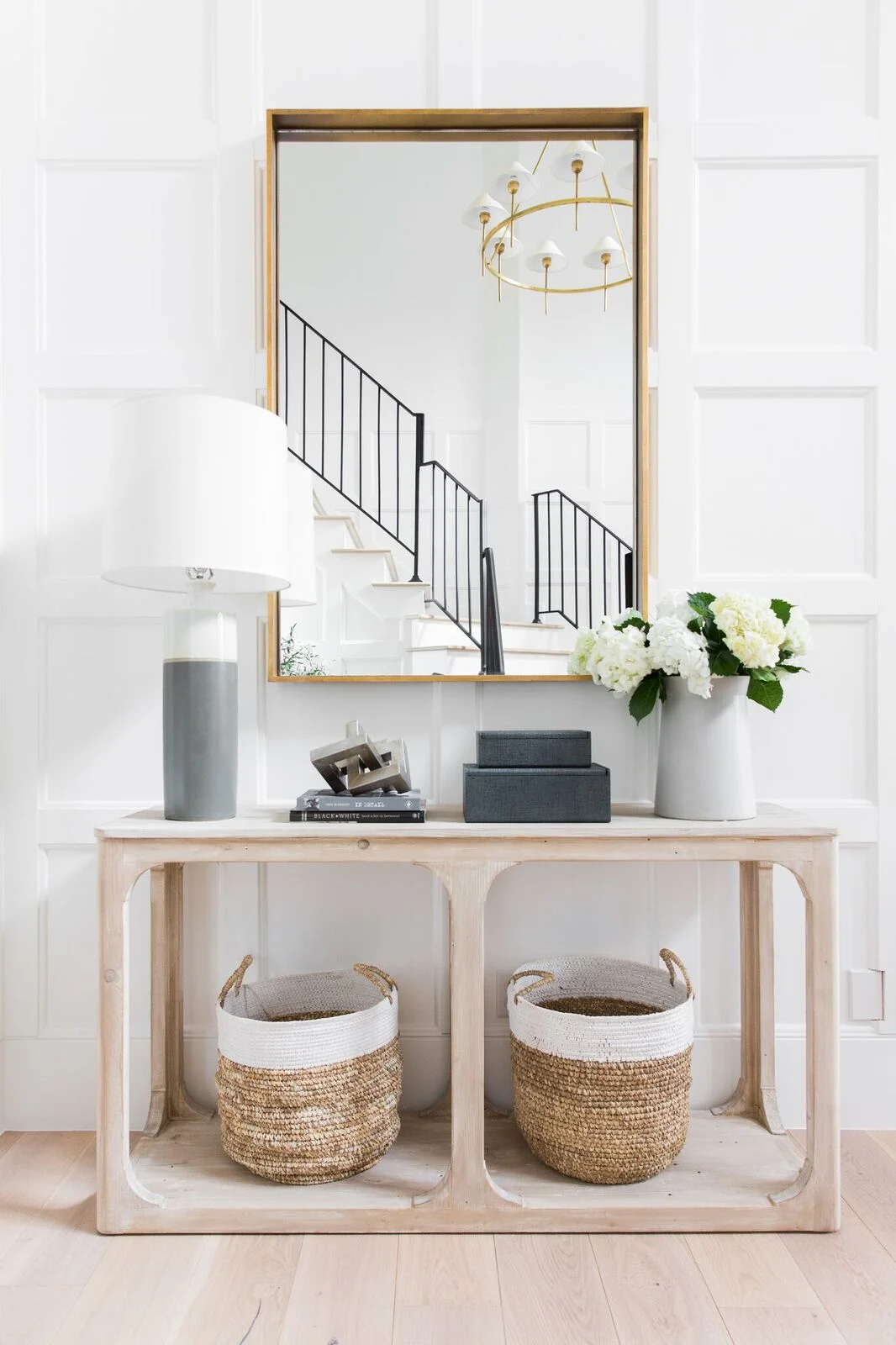 Add a console table to create an entryway and drop zone. Make an entryway even if you don't have a true foyer. See more creative entryway ideas on the Mix & Match Design Company blog!