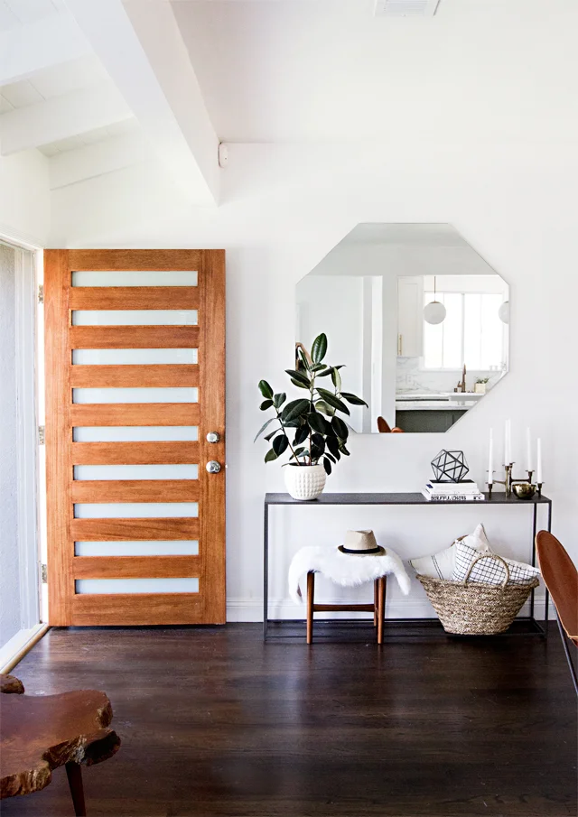 Add a console table to create an entryway and drop zone. Make an entryway even if you don't have a true foyer. See more creative entryway ideas on the Mix & Match Design Company blog!