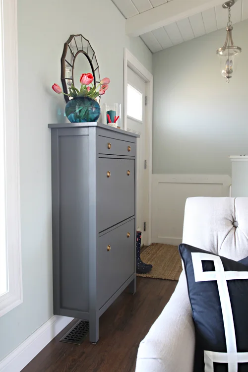 Add a shoe cabinet to create an entryway and drop zone. Make an entryway even if you don't have a true foyer. See more creative entryway ideas on the Mix & Match Design Company blog!