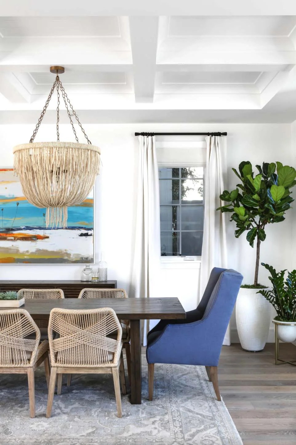 Get the look of this traditional meets beachy dining room on the blog! Coastal vibes, clean lines, and a touch of farmhouse make this space feel both cozy and sophisticated.