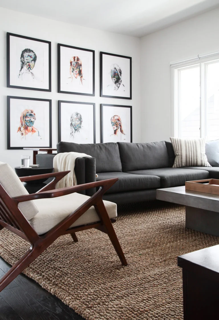 Love this moody, modern, and masculine living room? Head to the blog to find out how you can get the look inspired by this neutral living room and others!