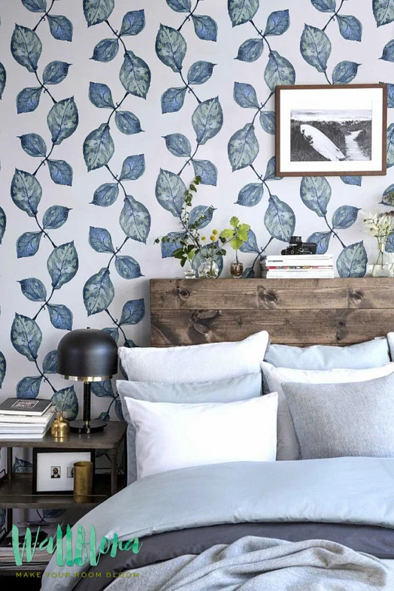 Inspiration for Mix & Match Design Company's guest bedroom makeover for the One Room Challenge. Loving the mix of blue bedding, blue-green floral wallpaper, and the warm wood headboard.