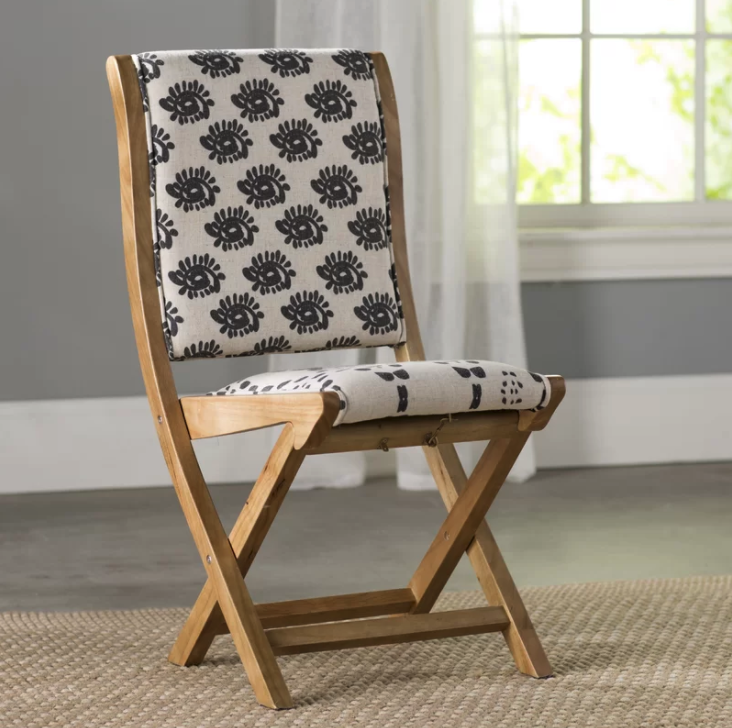 Beautiful upholstered folding dining chairs with pattern.