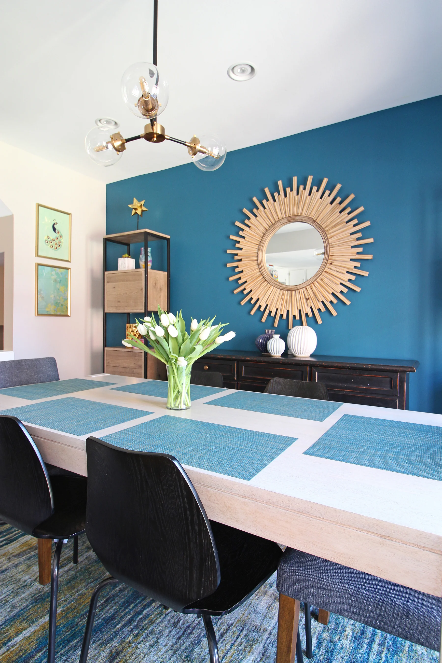 Wall Color: Galapagos Turquoise by Benjamin Moore in this modern dining room. Come learn how to choose the right paint color for your walls in this blog post! I teach you my go-to to method!