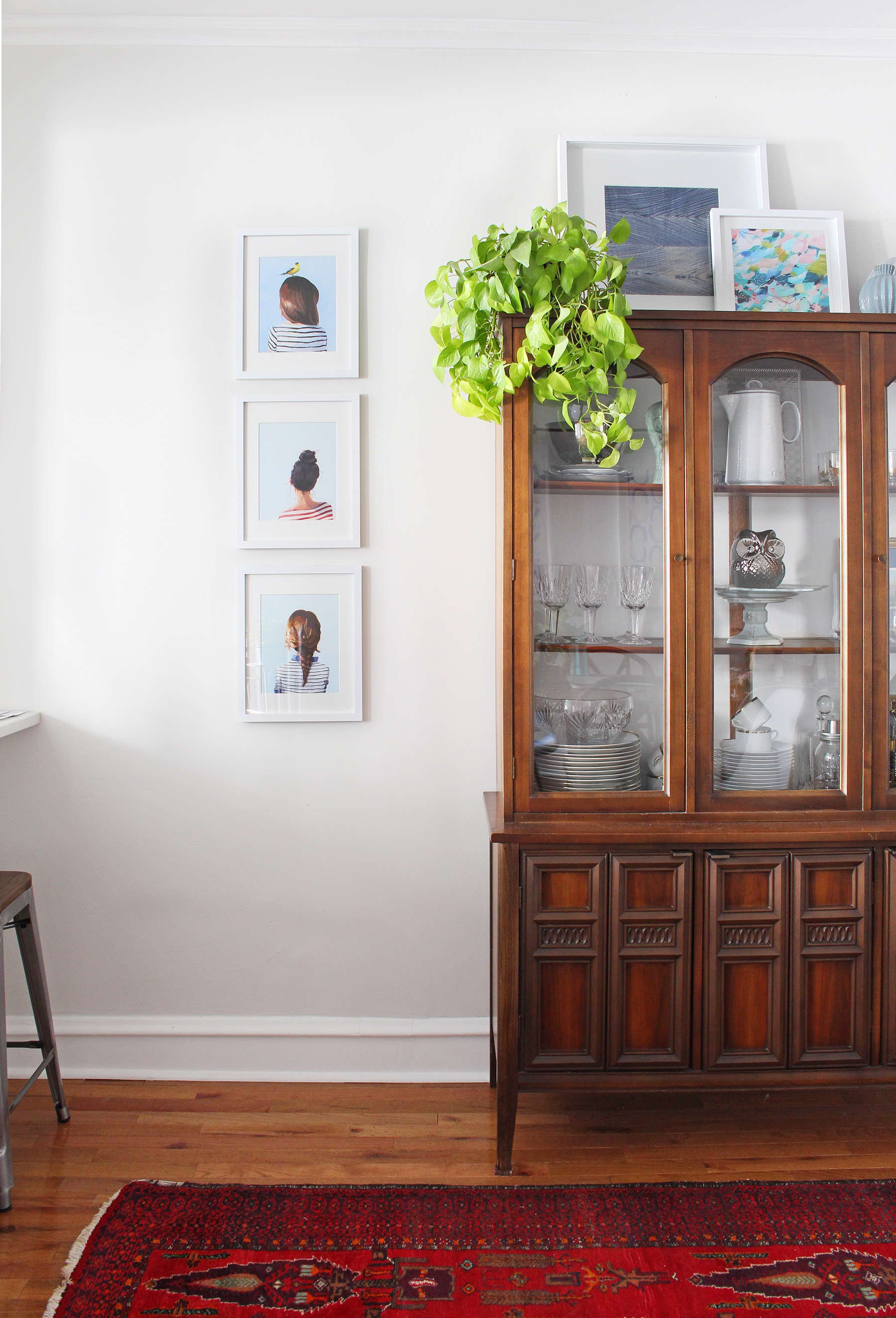 I loved collaborating with Corduroy Company on this little styling project in my dining room! Those charming back of the head prints, abstract art print, and indigo mudcloth work beautifully with my mid-century china cabinet.