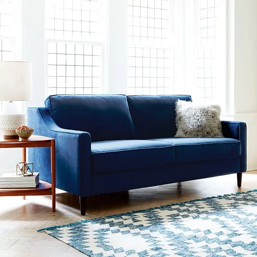Buying a sofa soon? There's a lot to think about! Here's a guide to helping you think through how to find the perfect couch for your home. // Navy velvet sofa, how to pick a sofa, shopping for a sofa, sofa buying tips.