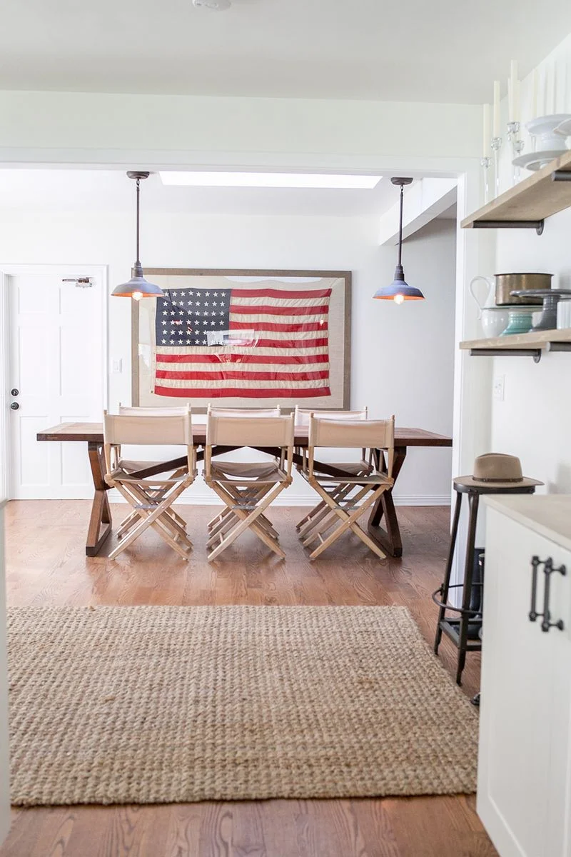 How to use American flags as decor. I love how this framed American flag looks in this simple dining room.