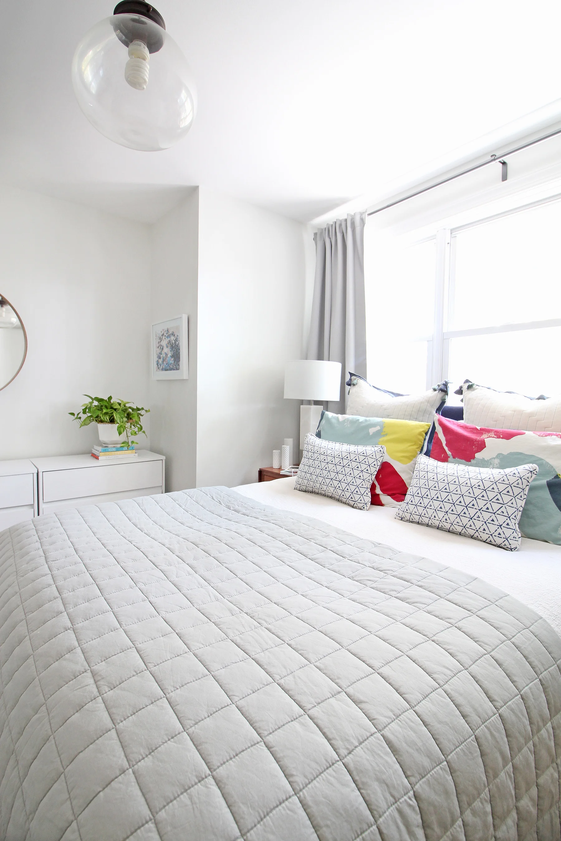 Head to the blog to check out Mix & Match Design Company’s mini refresh of her eclectic modern master bedroom. A gray linen quilt works beautifully with her tasseled euro shams, watercolor shams, and blue and white lumbar pillows.