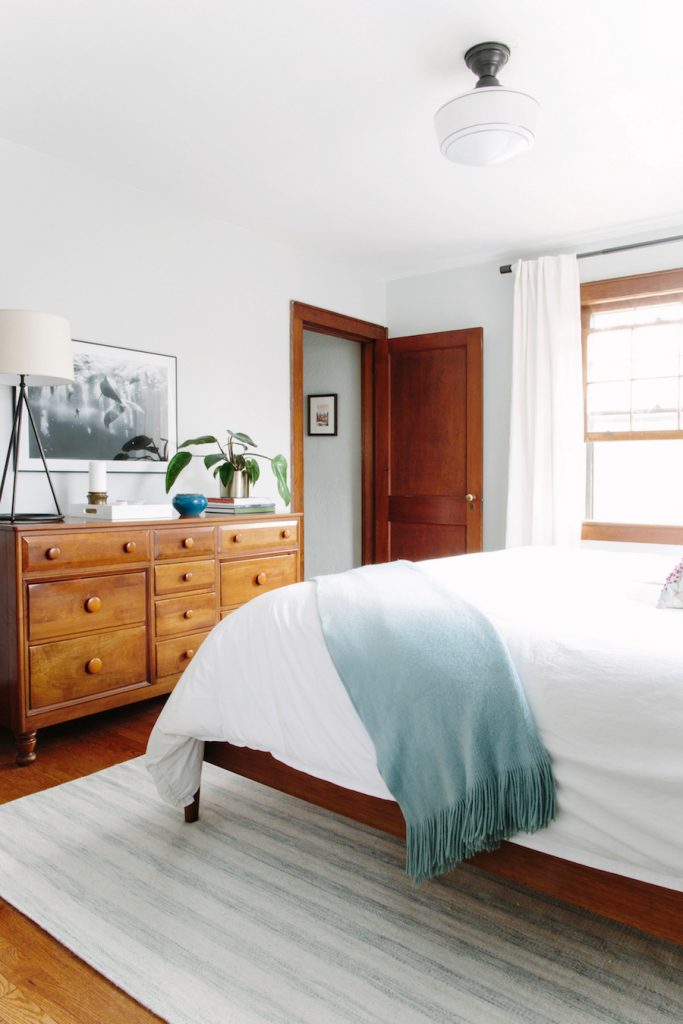 Working with wood trim can be a challenge, but this new traditional style bedroom proves that it can be done well! They mixed old and new beautifully and helped keep things bright with white walls and linens.