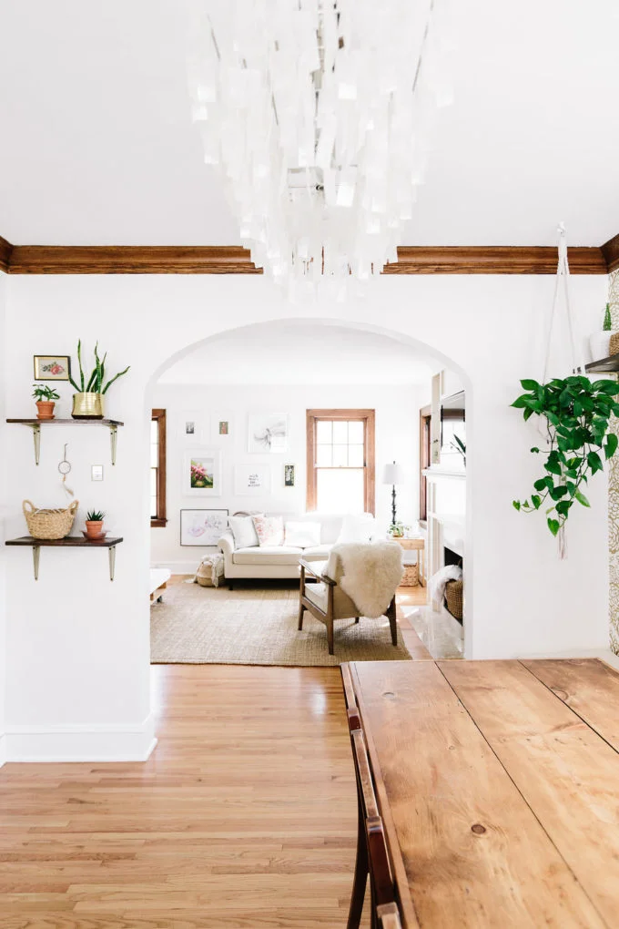 Working with wood trim can be a challenge, but this transitional farmhouse living room proves that it can be done well! They kept things bright and airy with white and light colored furniture and decor.