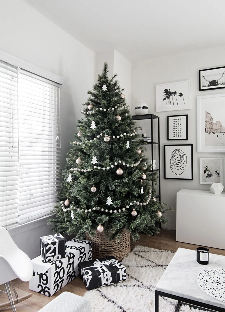 This modern, minimalist Christmas tree is beautiful in its simplicity. Love that it’s in a basket for a base as well!