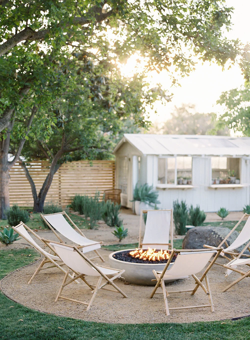 outdoor dining table with fire pit in the middle on Outdoor Mix Match Design Company Blog