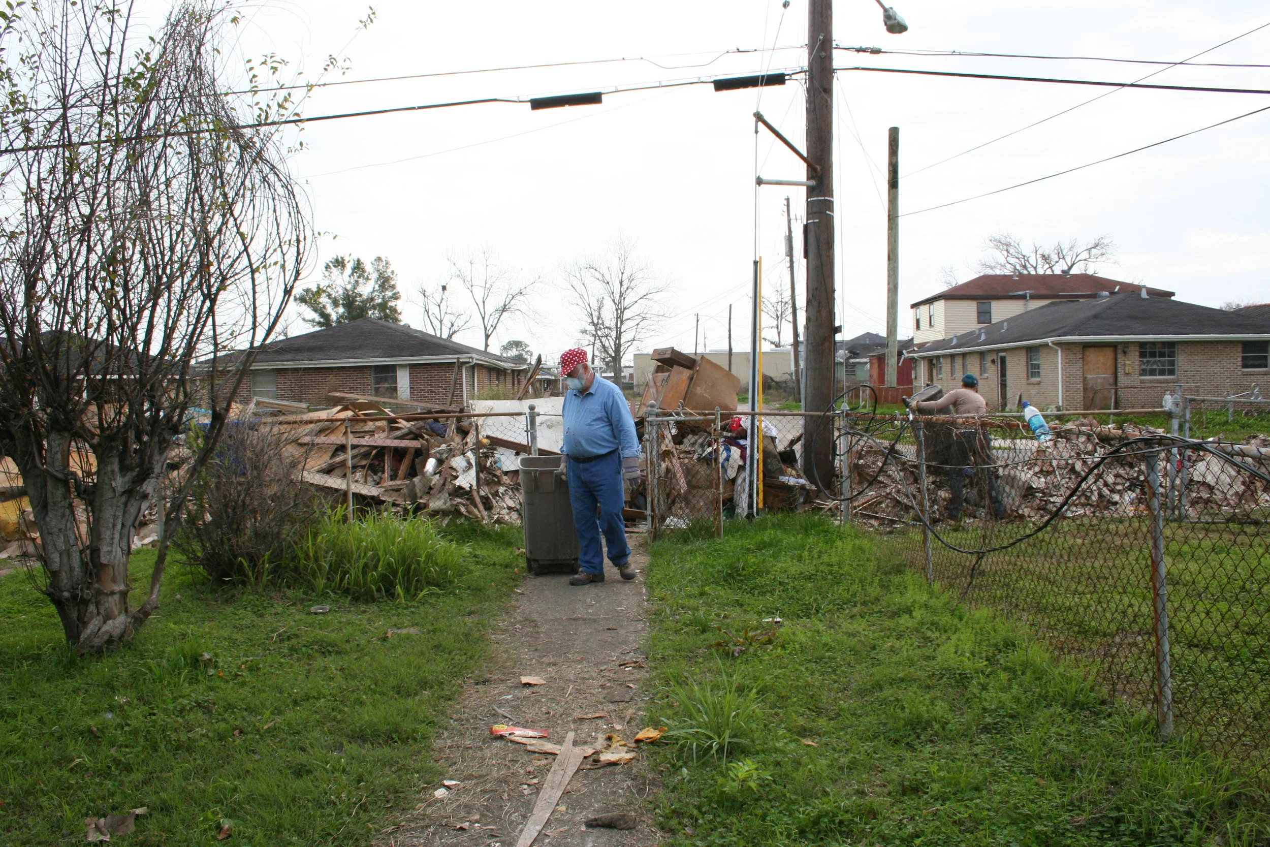  One of many trips back and forth, bringing pieces of the house out to the road. 