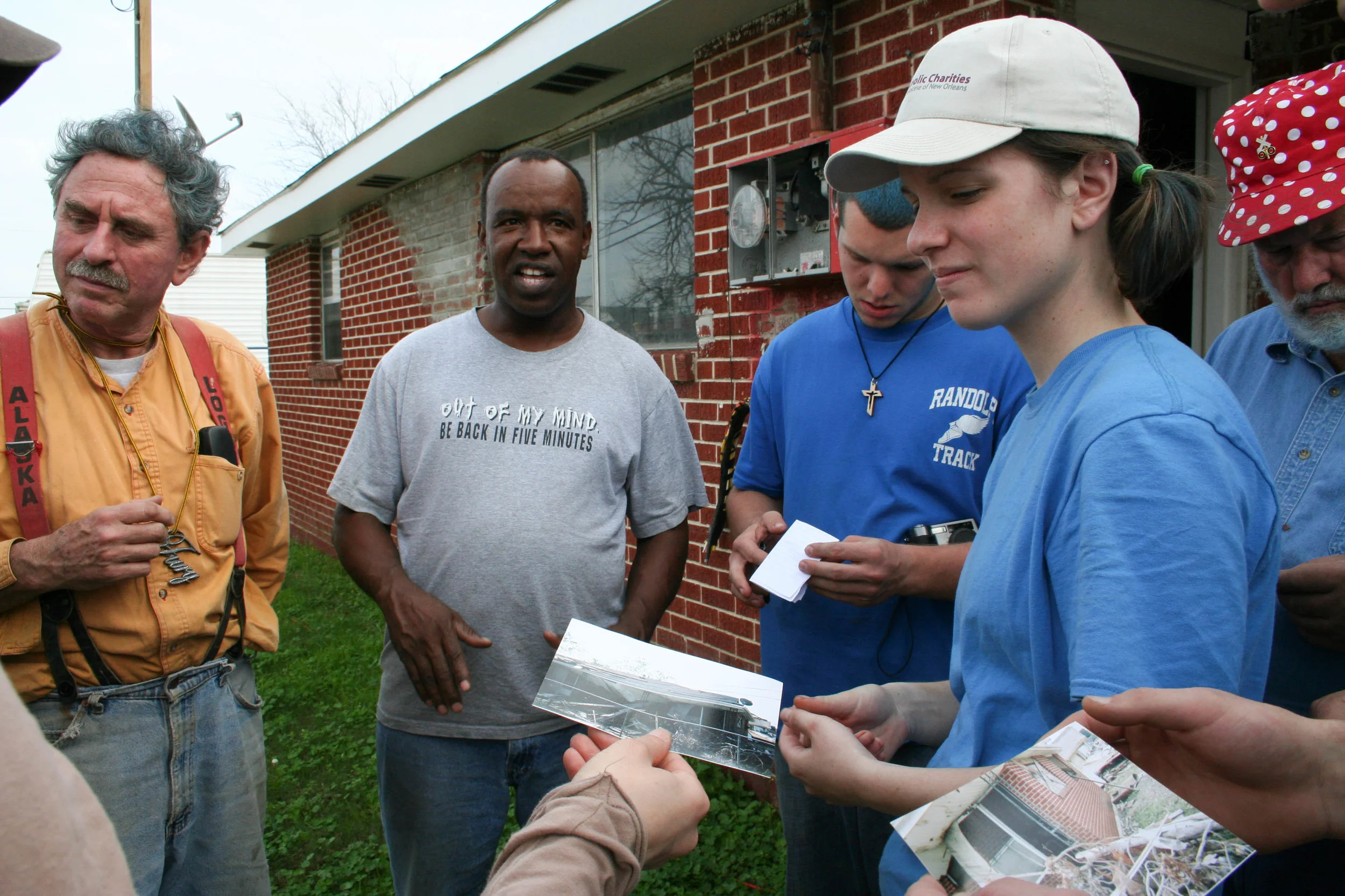  Neighbor showing the damage done to his house in pictures, and the progress he's made. 
