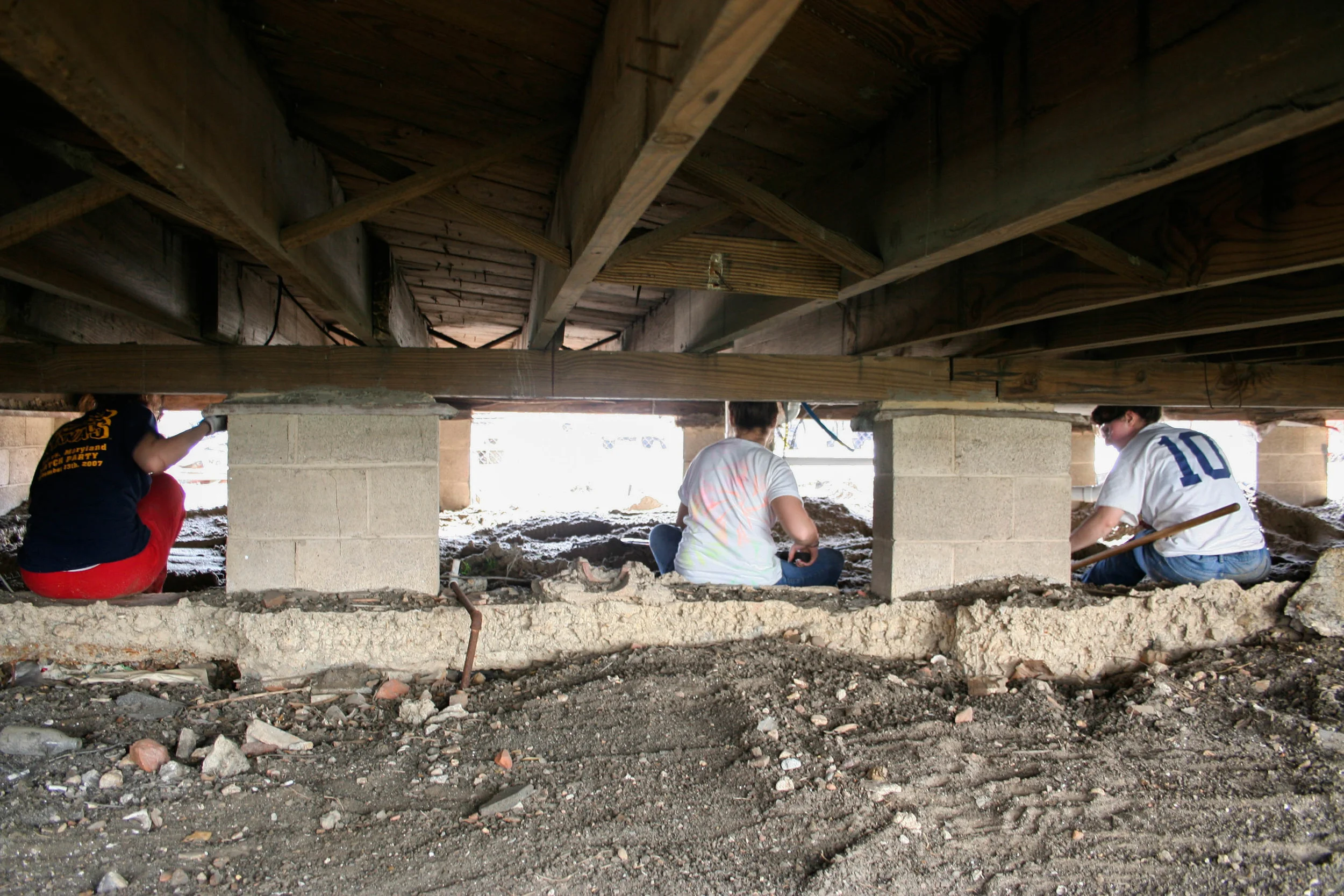  Bringing sand under the house 