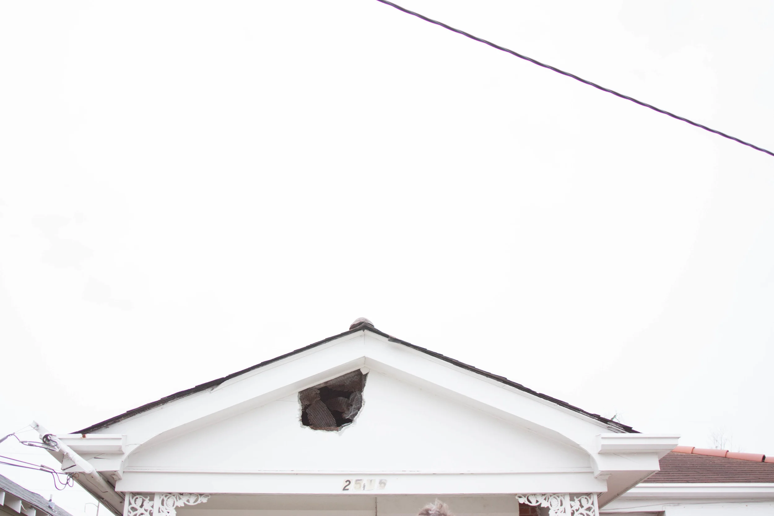  Hole from the attic where the homeowner was able to get out of during the storm. 