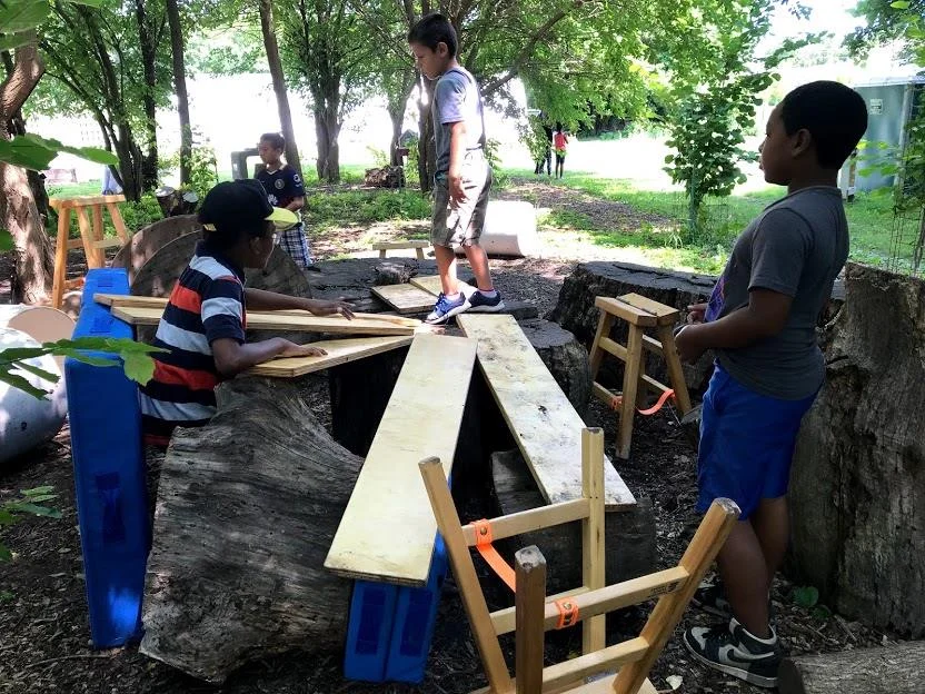 Kids engage with Anji Play materials at Troy Gardens in Madison, WI.