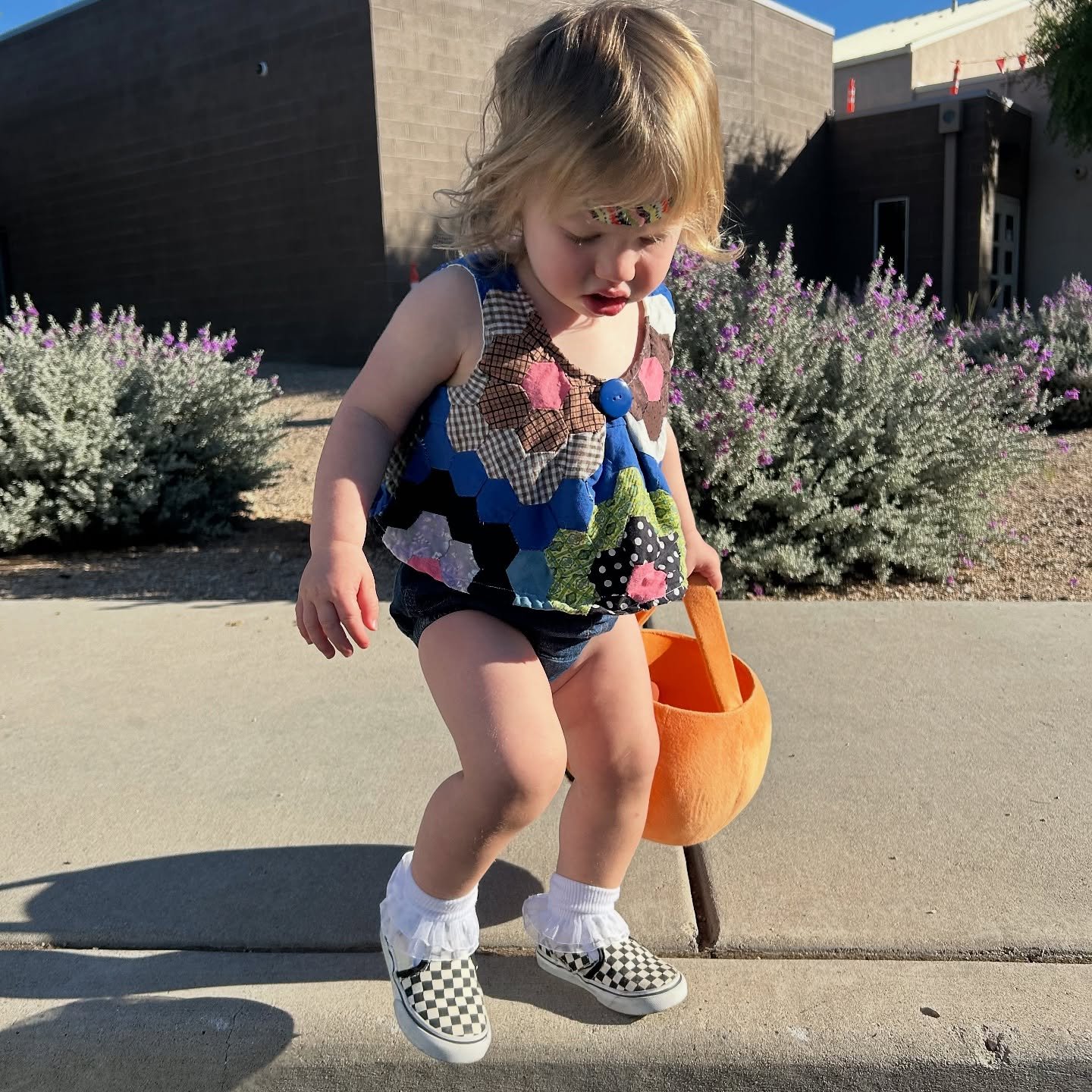 One of our favorite toddlers in a sample top we made from a vintage cutter quilt. Should we make tops!?