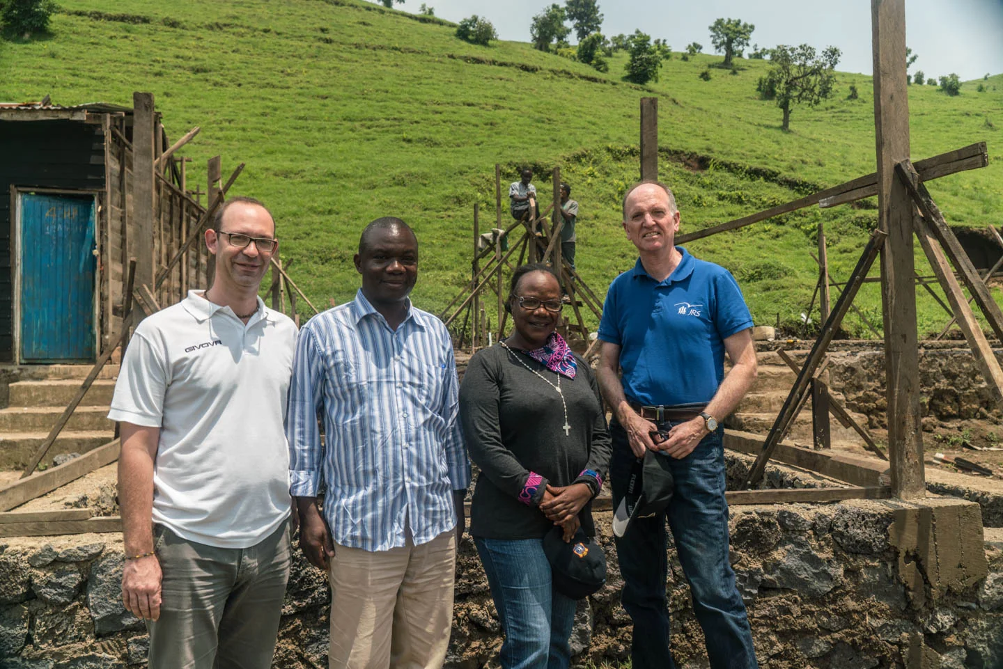 Fr. Tom Smolich, International director of Jesuit Refugee Service, visits a JRS sponsored school building site with the local coordinator, a local priest and the construction manager, Lillan.
