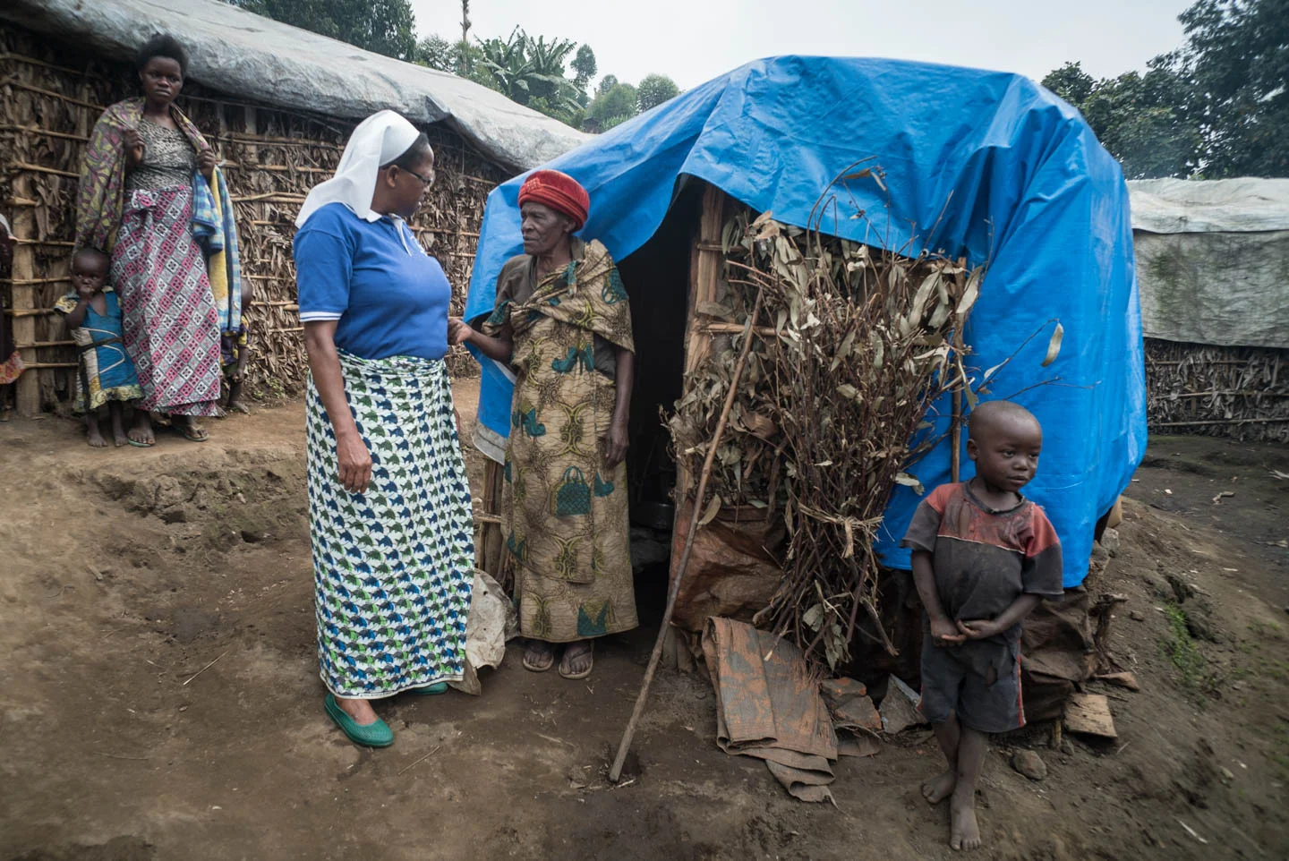 Sr Regina Missanga visits Cecilia, a resident of the Kalinga refugee camp for internally displaced persons (IDP) outside of Misisi. JRS provided her a shelter which cost about $29.