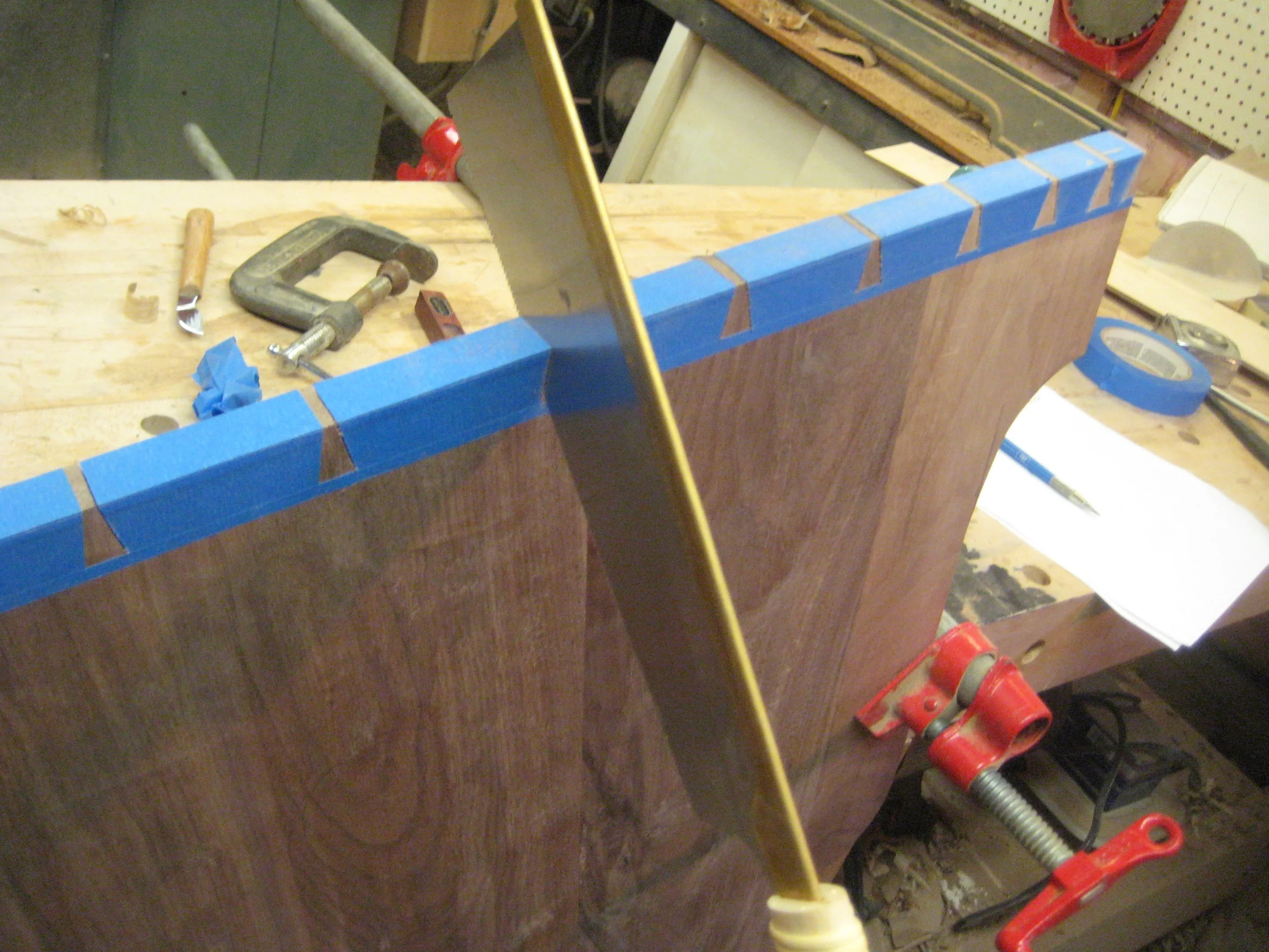 Each tail is first cut carefully with the dovetail saw.