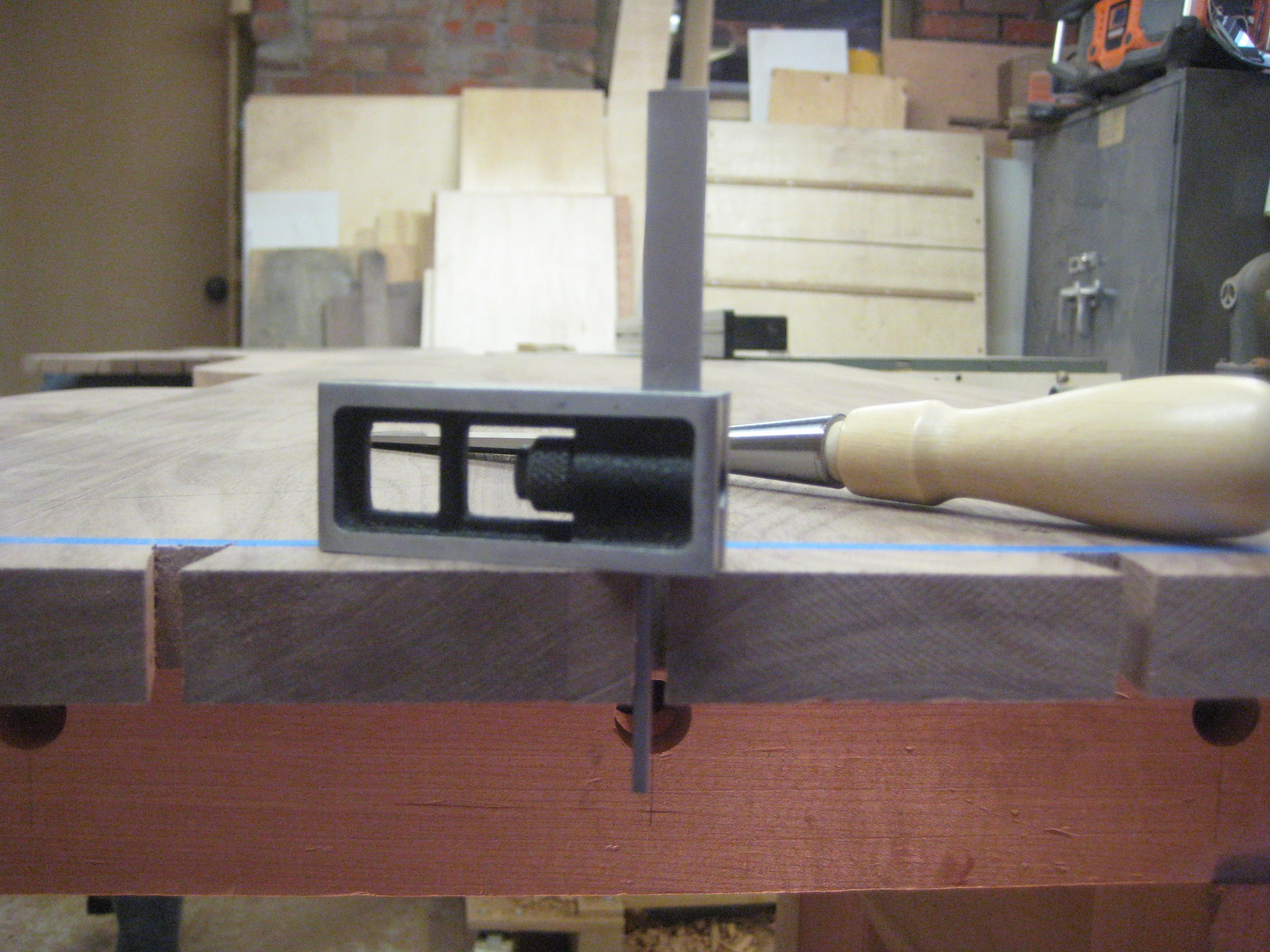 before I go any further, I have to check every tail for square. This is a VERY important step to making perfect dovetails. If the tails aren't square, I pare them with my chisel to make them perfect. 