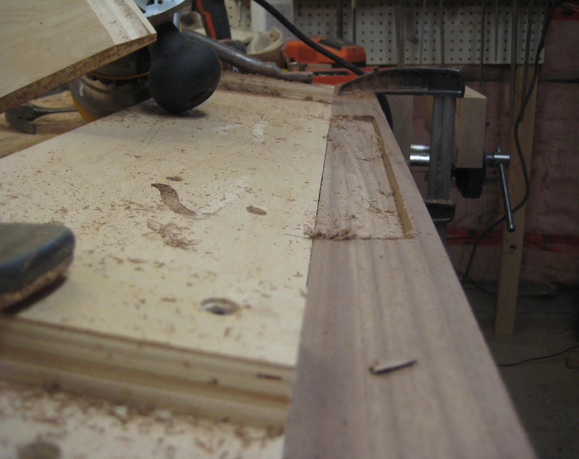 An angled ramp for my router sent the bit into the wood to create an angled recess. 