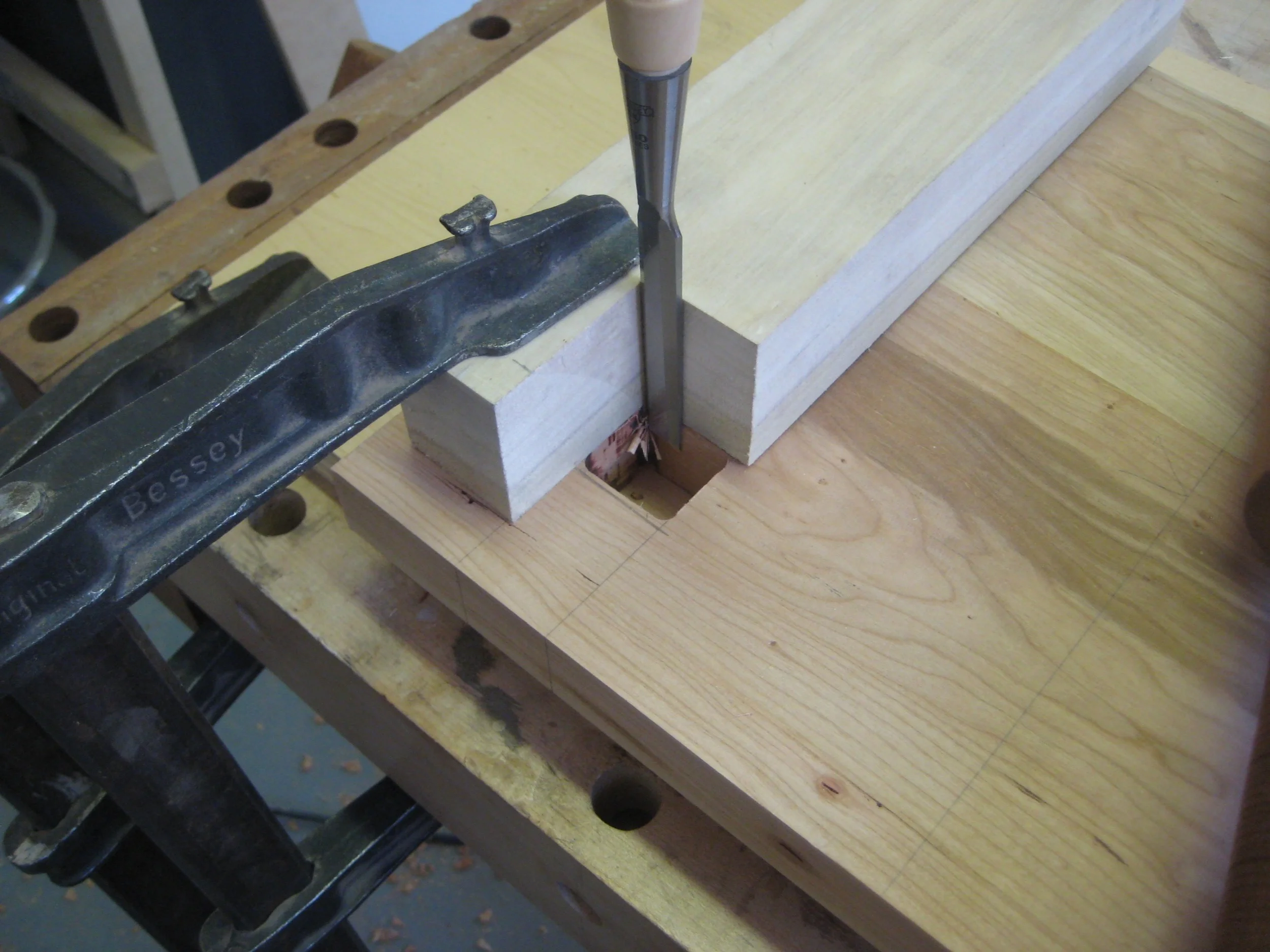 Finally I chopped out the corners left by the router to make a perfect square hole.