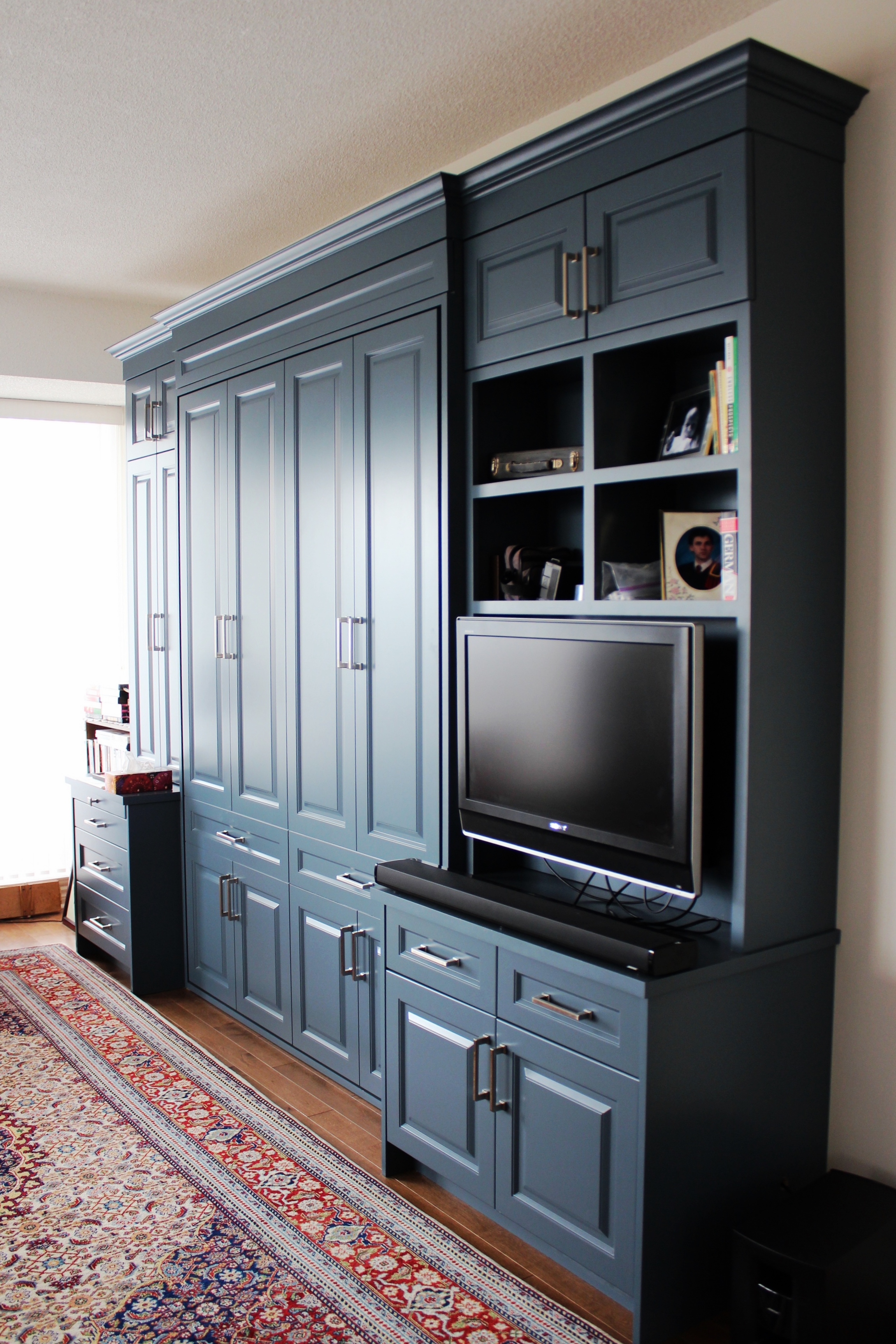 Built in 'murphy style' bed with lots of storage options. Bed closed in photo