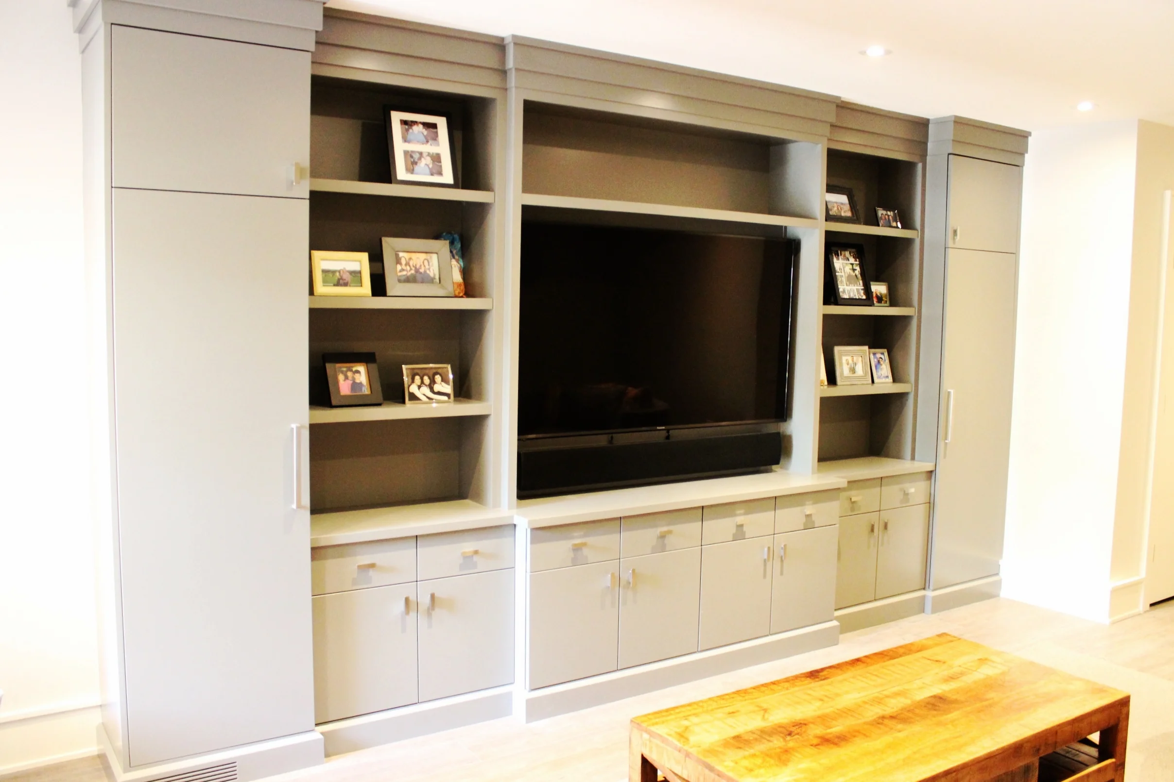 Basement fireplace unit with all built in electronics and even a heating vent concealed for a clean modern look.