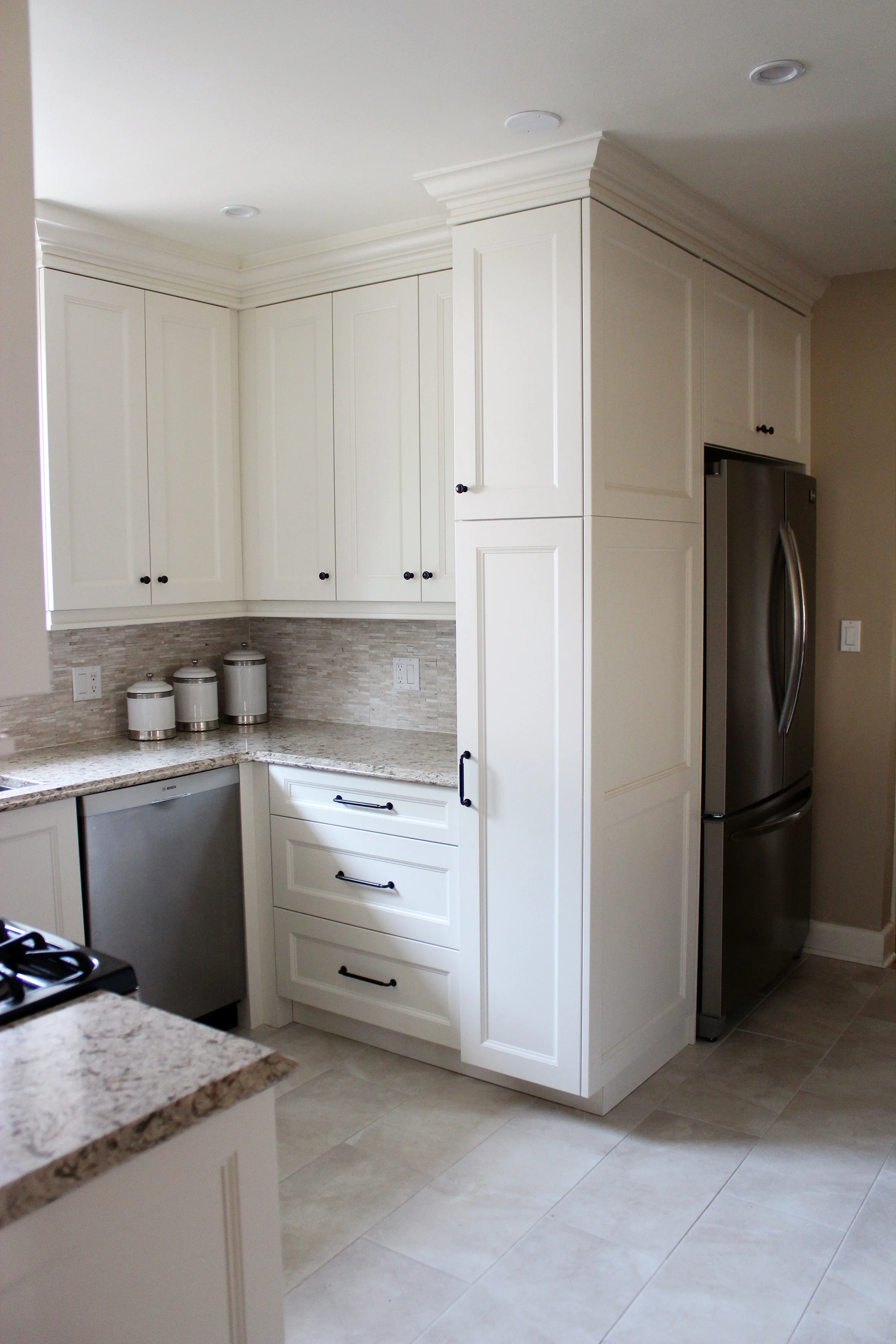 Full height pantry uses ALL the space: helps to build in the fridge, as well as amp up storage. 