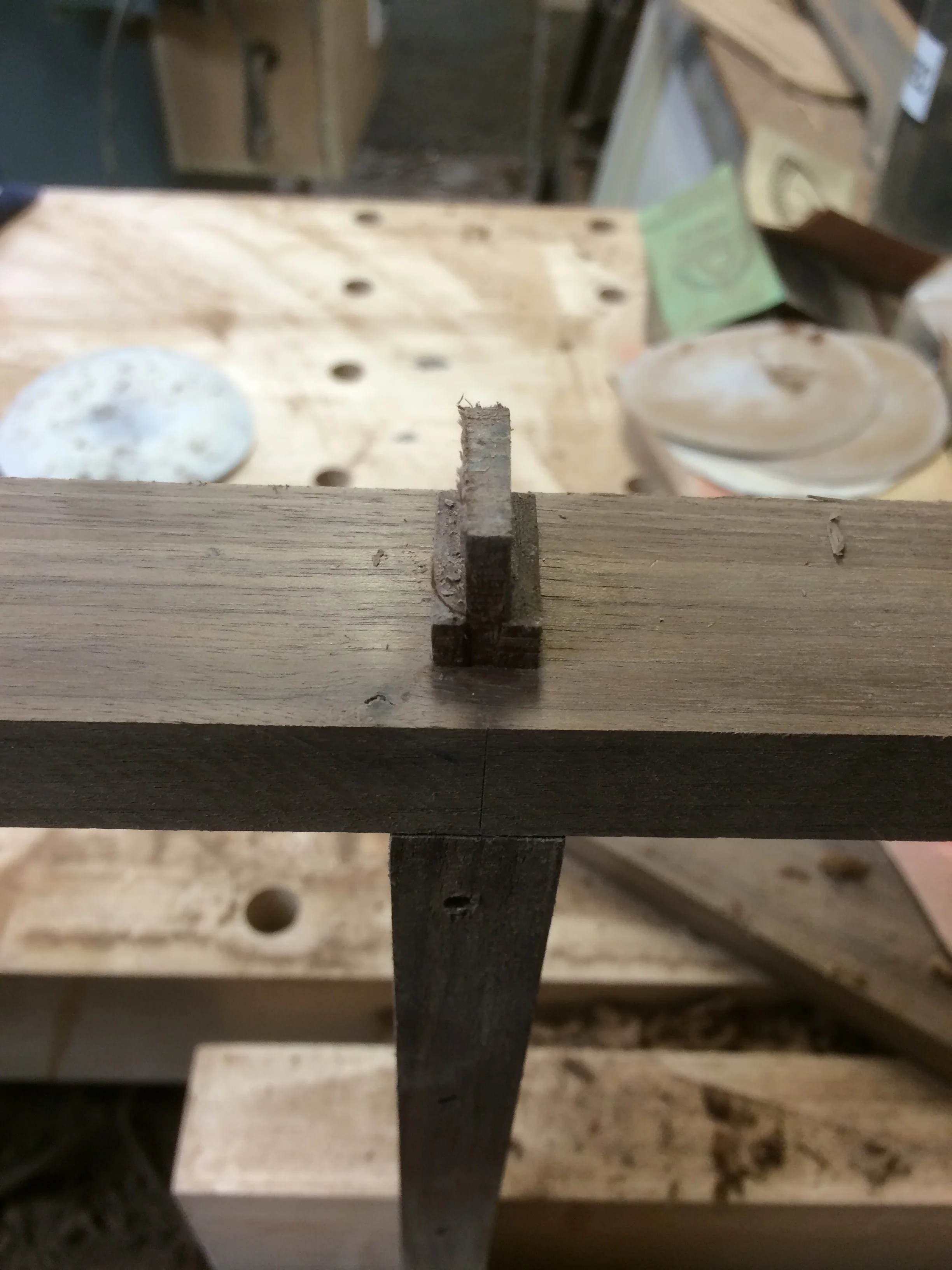 Here you see the rail tenon coming through the other rail, and being wedged to expand one side. This creates a mechanical joint that does not rely much on glue. 