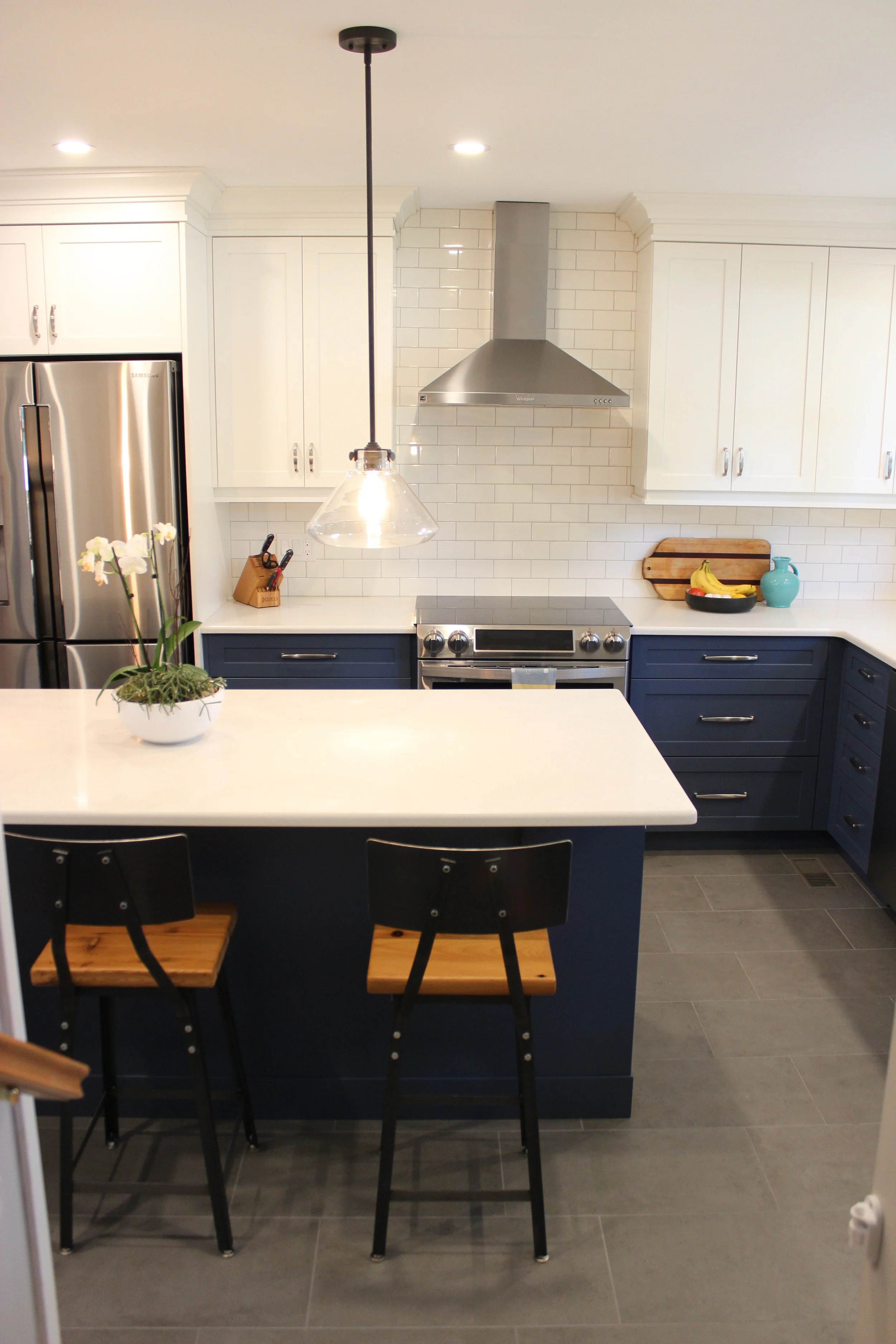 Stainless steel, white, blue, and natural wood work together nicely